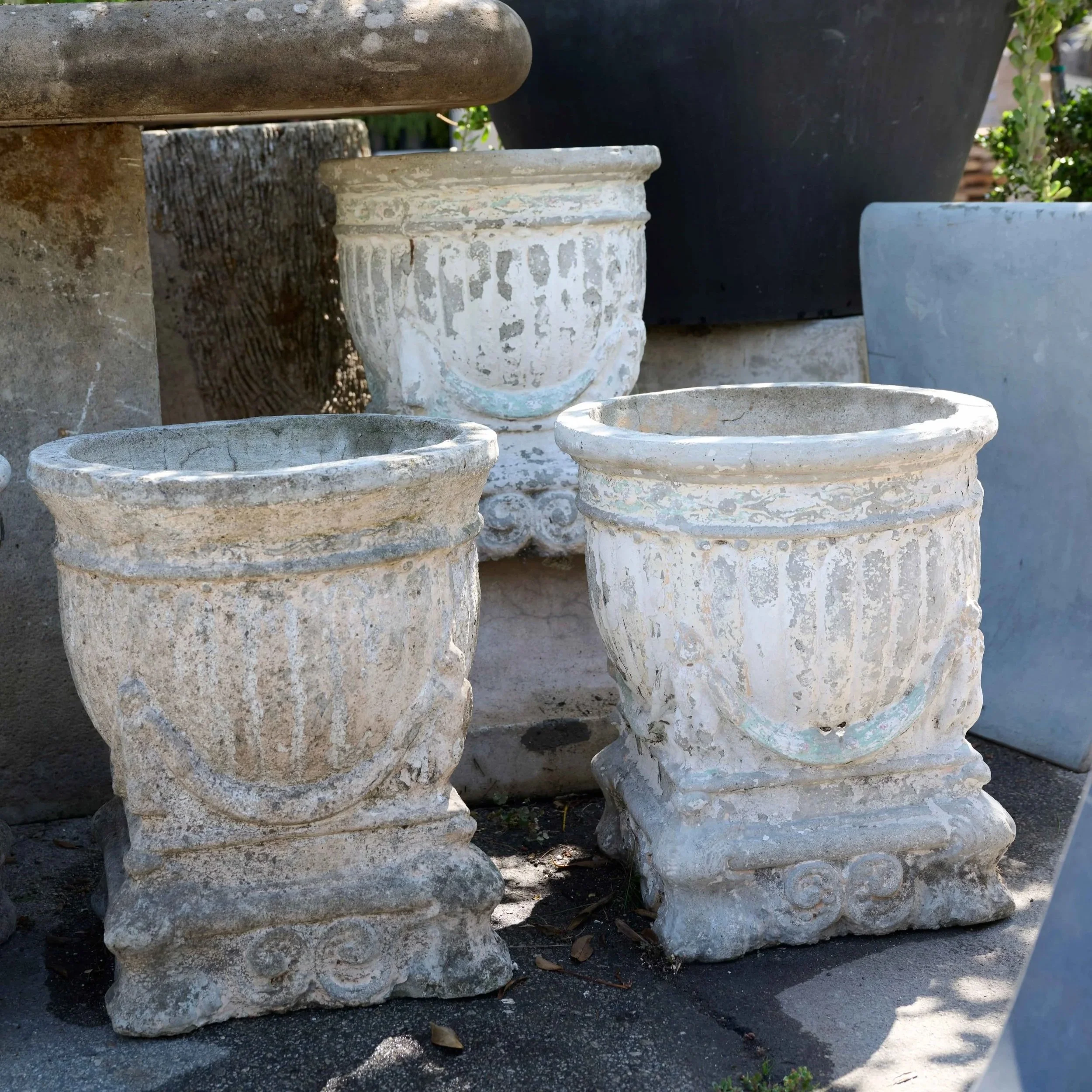 IG20745+Set+of+4+Italian+Cast+Stone+Planters+with+Garland+and+Putti+Sitting+on+Pillow+Pedestal+Normal+Losses+residual+white+paint+C.1920+19%27%27D+x+22%27%27H+%281%29.jpg