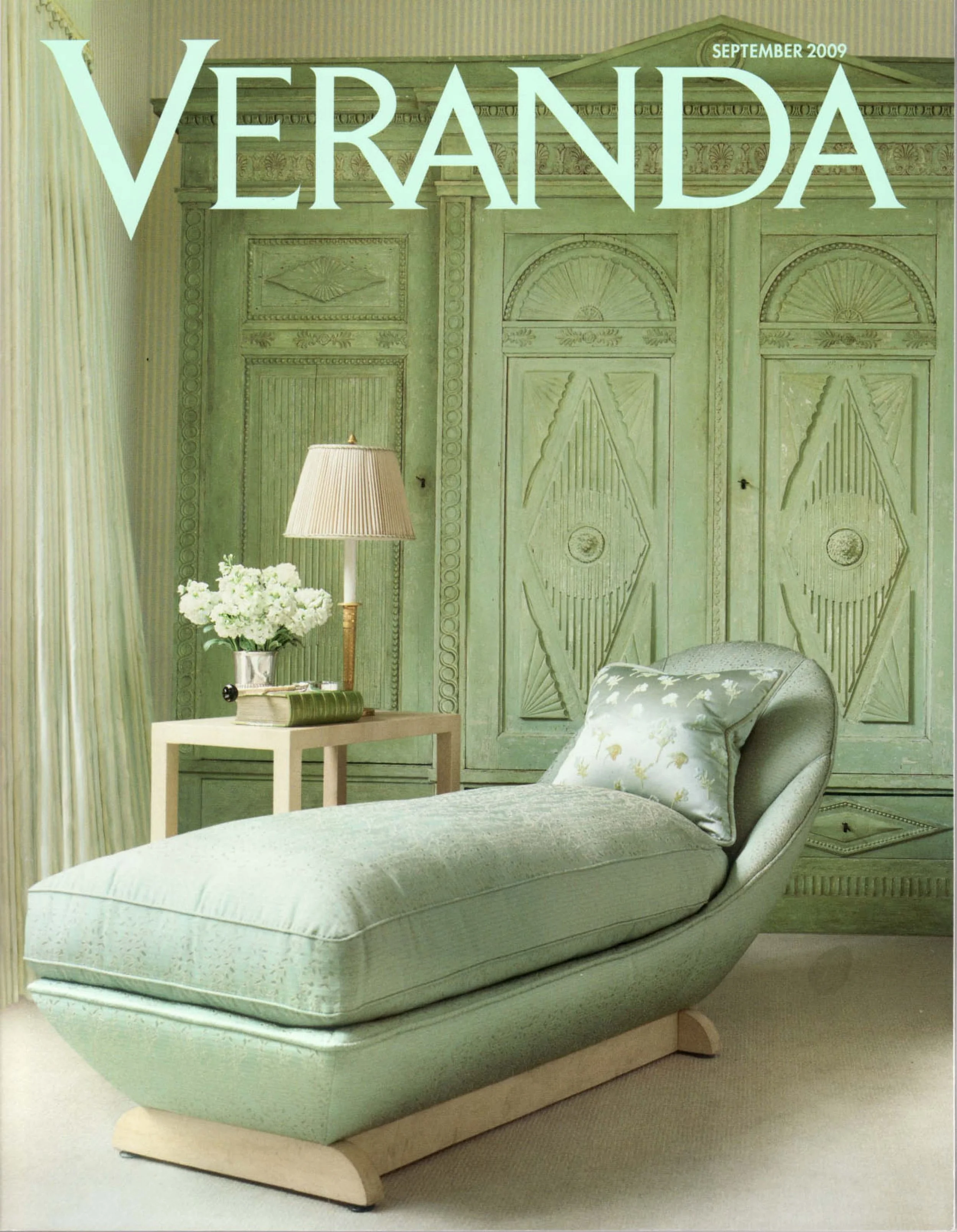 Magazine cover titled 'VERANDA' from September 2009 featuring a room with a green chaise lounge, a side table with a lamp and flowers, and a large green decorative wooden wall.