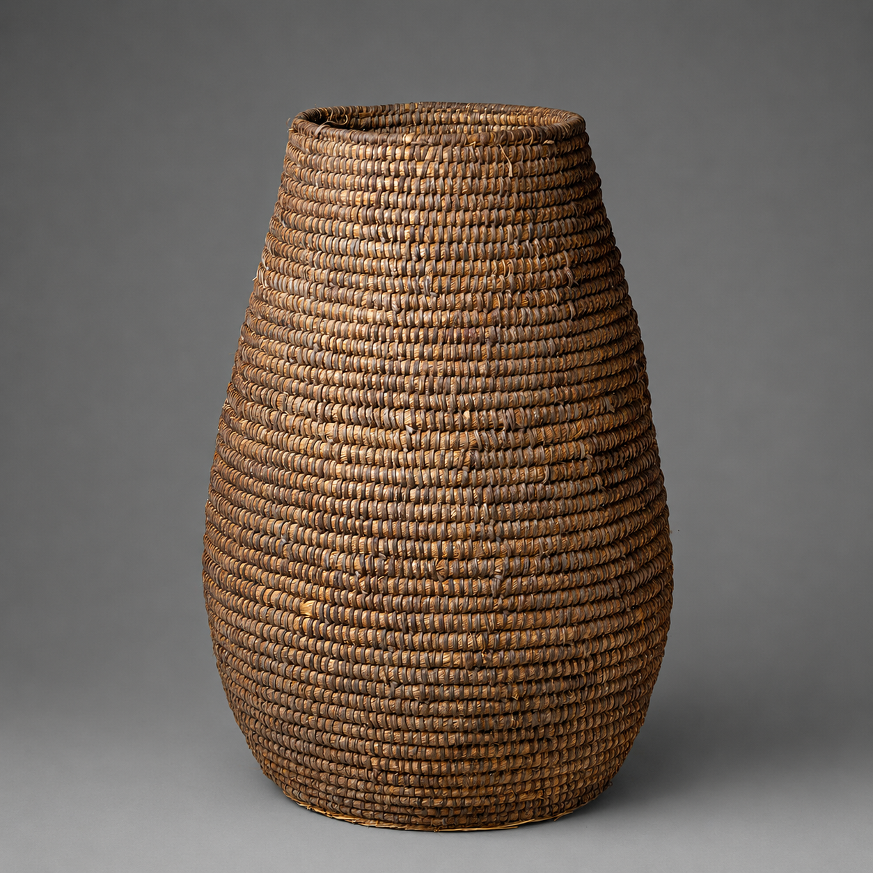 TALL RATTAN URN BASKET