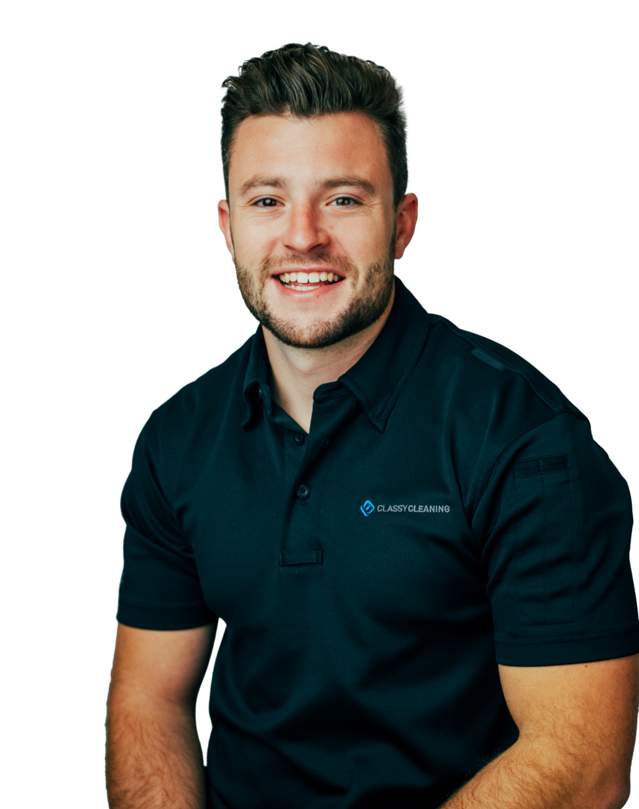 A smiling young man with brown hair and a beard, wearing a black polo shirt with a logo that reads 'Classy Cleaning'.
