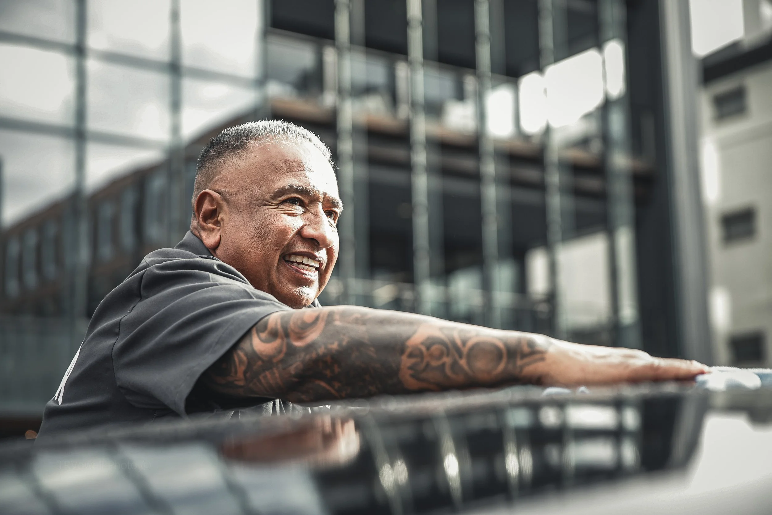 Close up candid real photography portrait of man business owner for business branding website profile working on car Denver Aurora Colorado