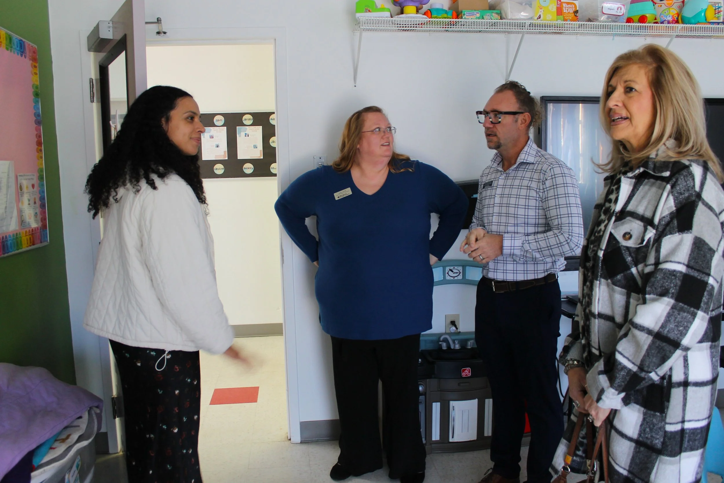 Erin takes time with Jessica, Jon and Lynne to show them around the campus.