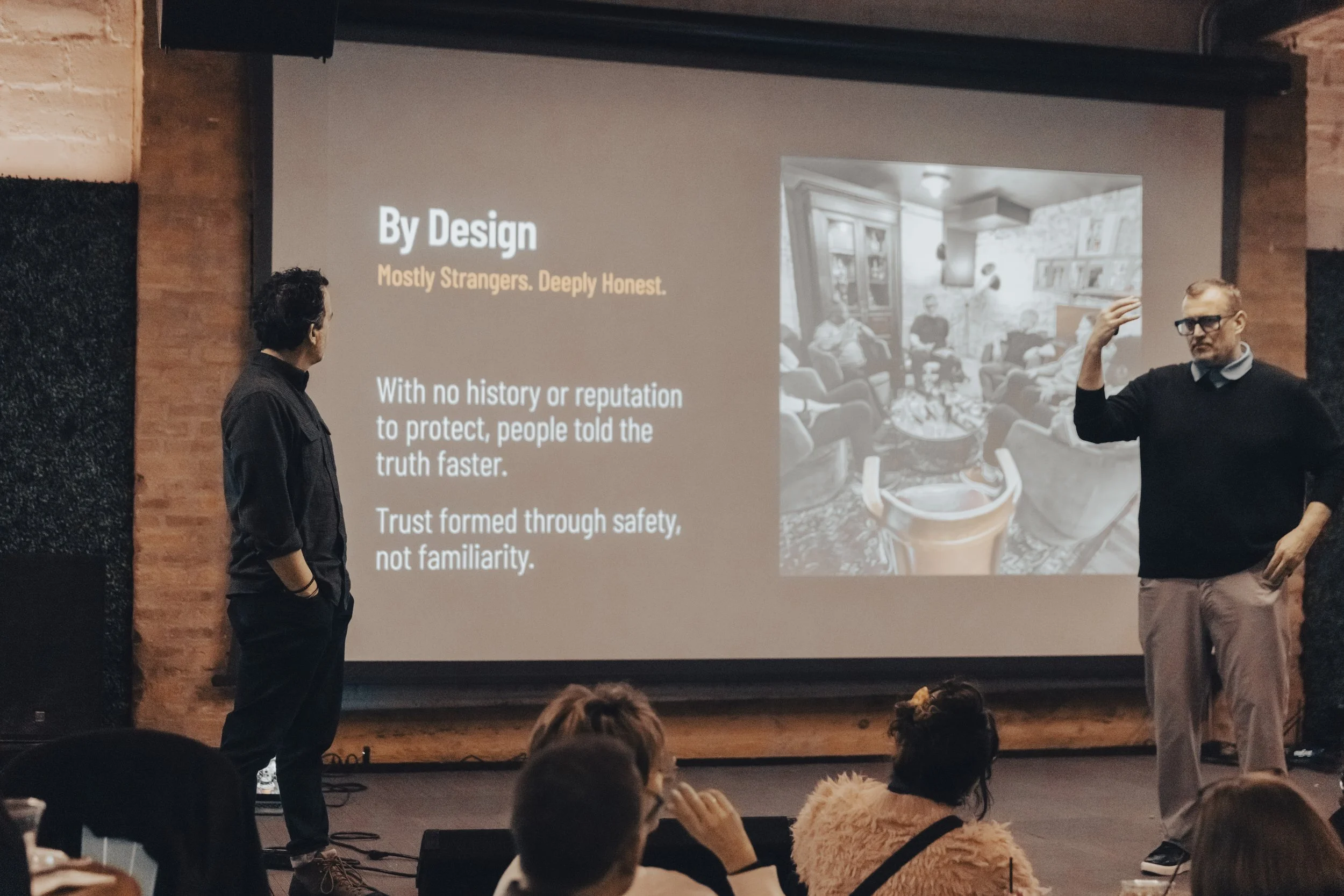 A symbol of a calendar with two rings at the top, displayed on a black background.