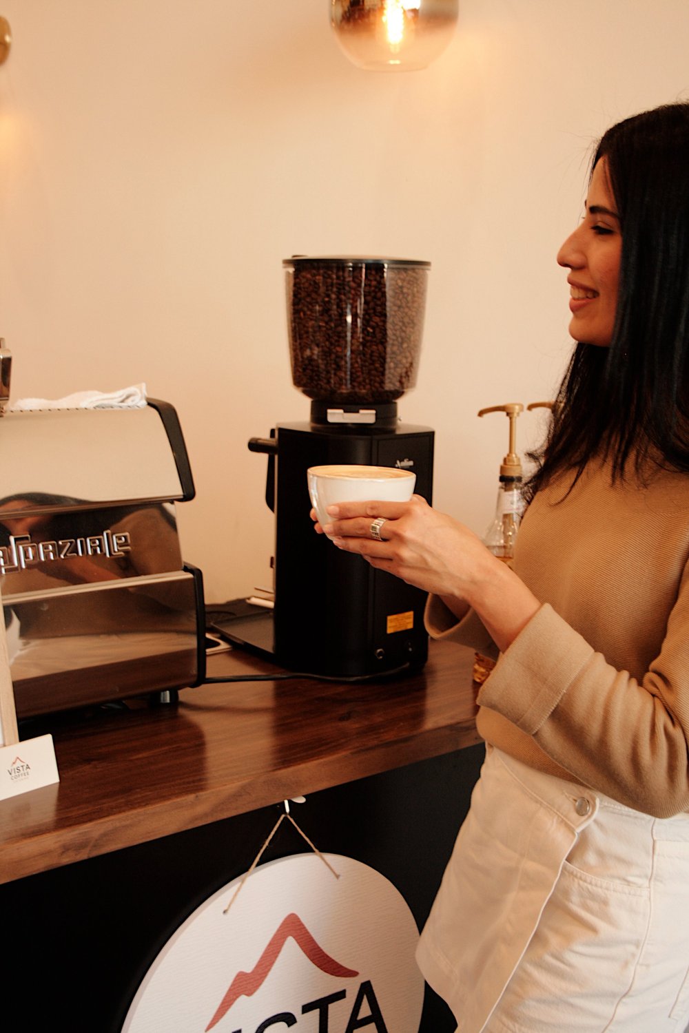 Guest enjoying a handcrafted coffee from Vista Coffee Catering