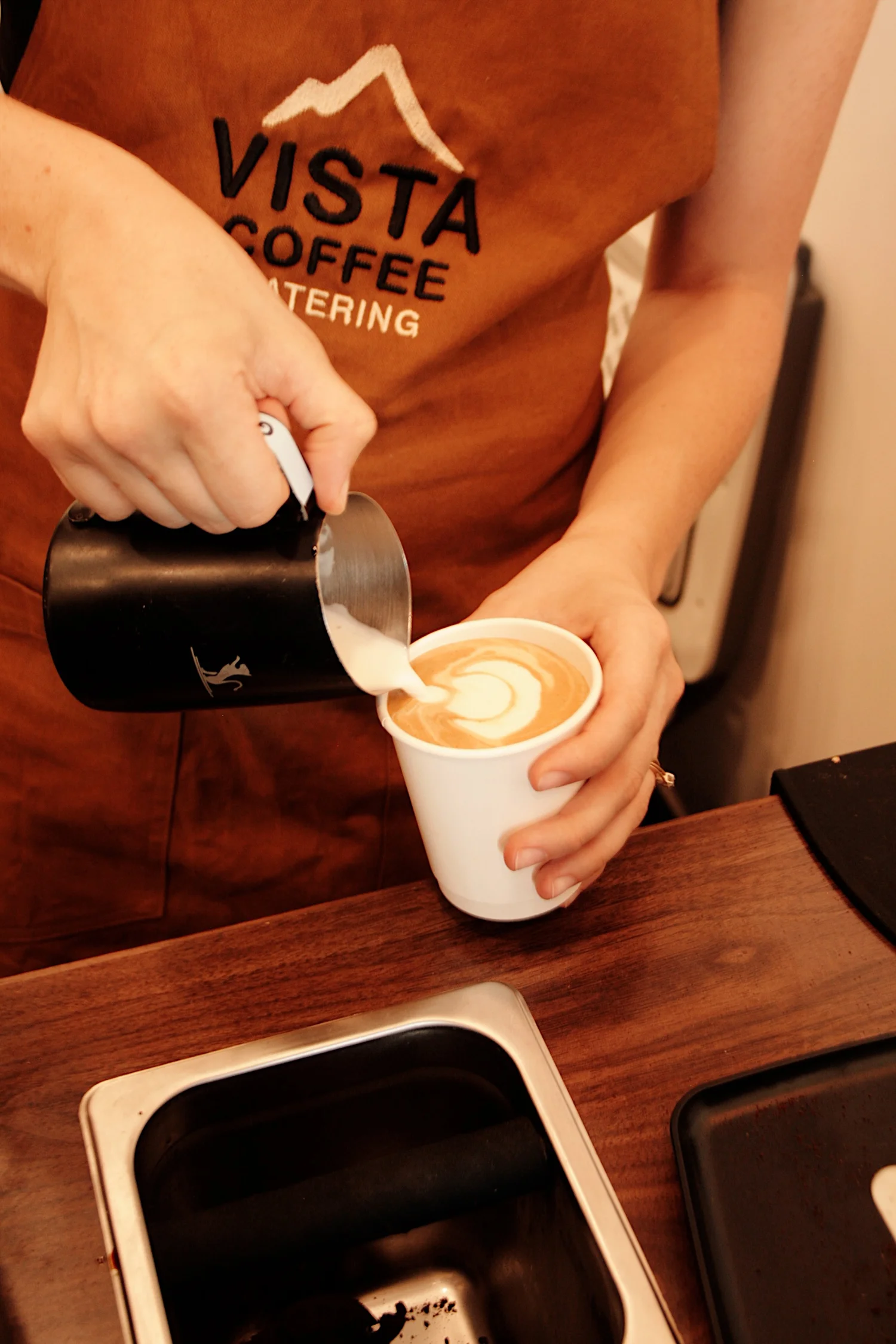 Vista Coffee Catering barista pouring latte art at a Philadelphia event