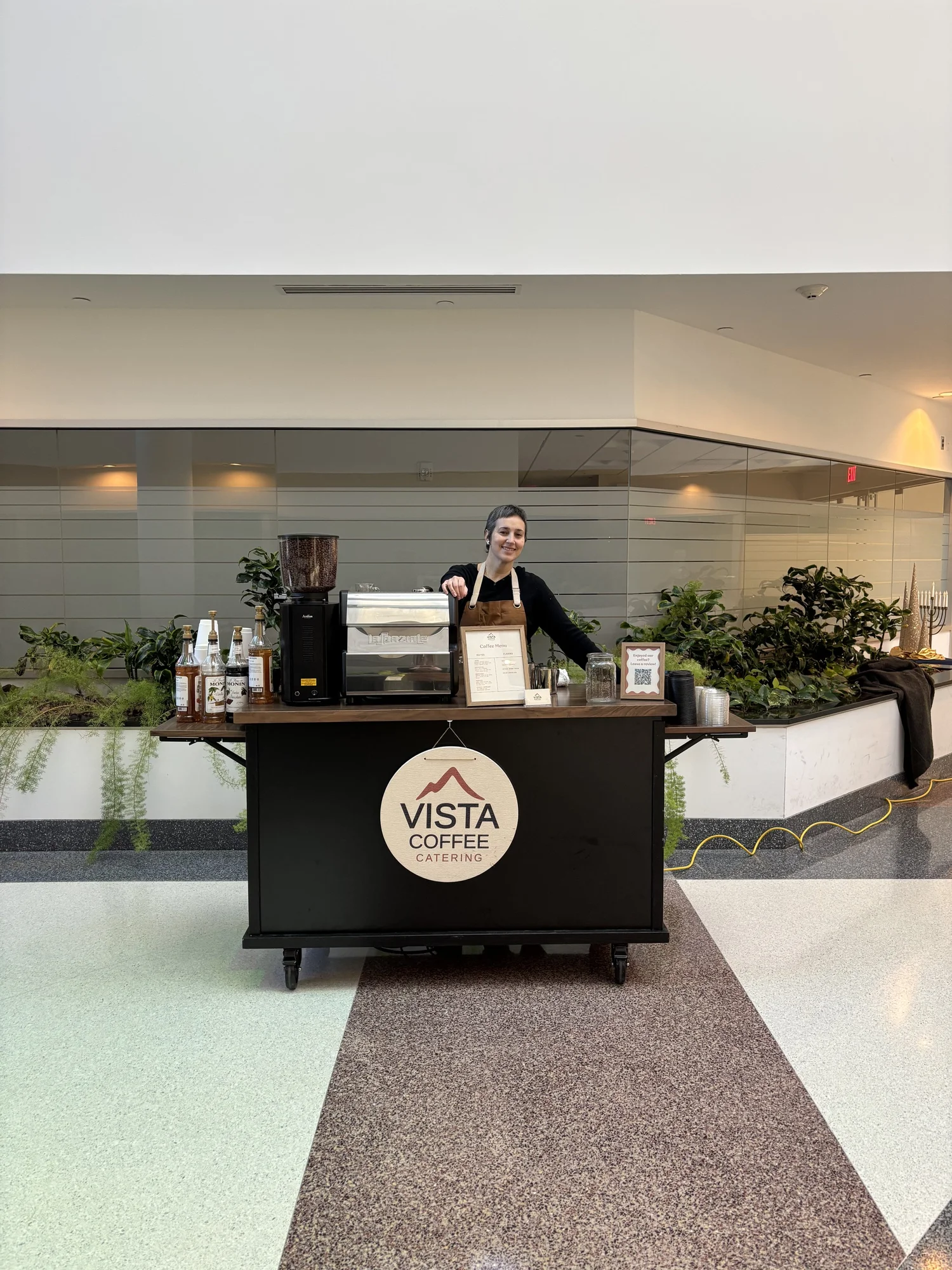 Vista Coffee Catering barista serving coffee at a corporate event in a modern Philadelphia building