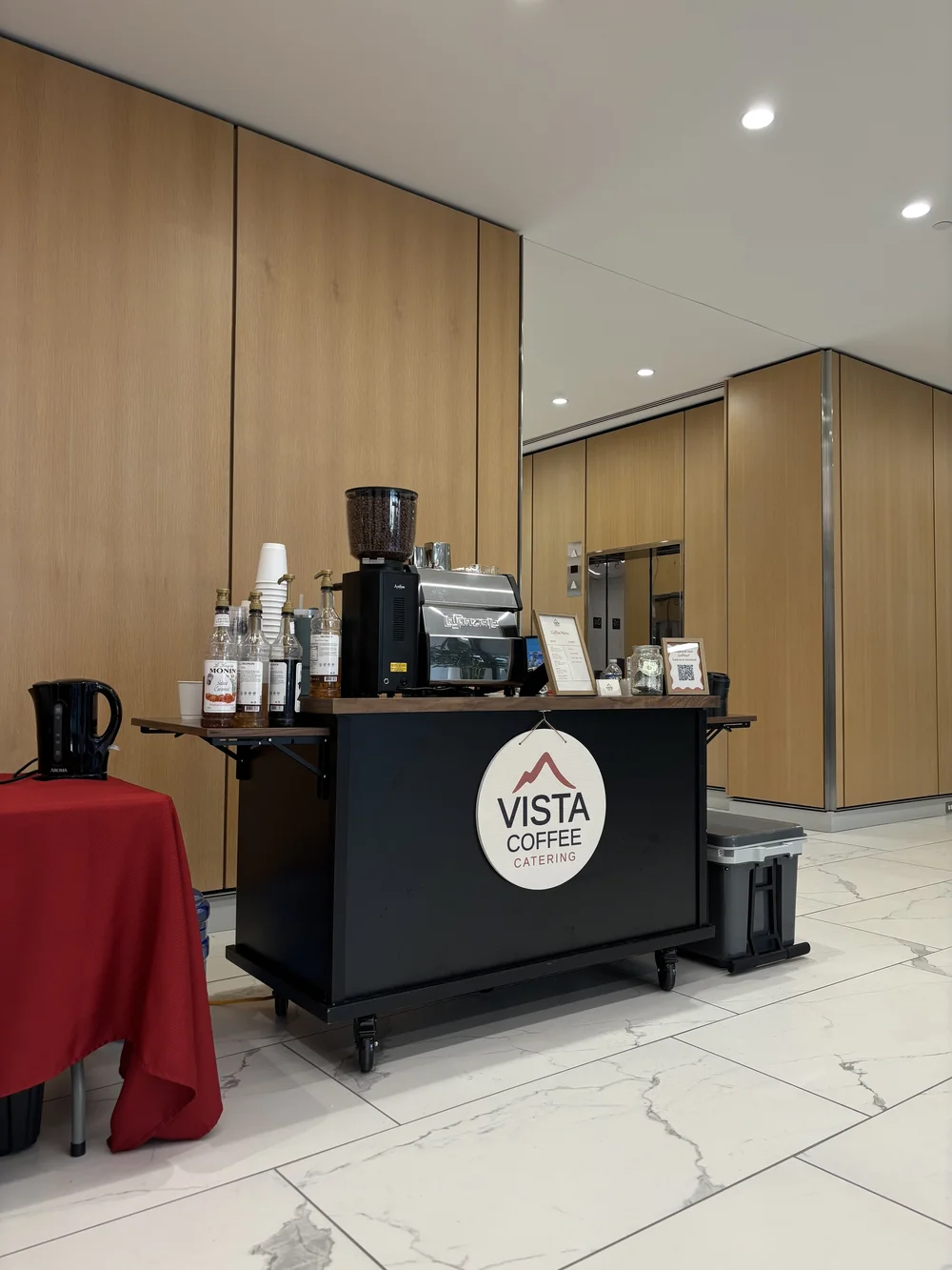Vista Coffee Catering espresso machine, grinder and syrups set up for coffee catering at a Philadelphia event