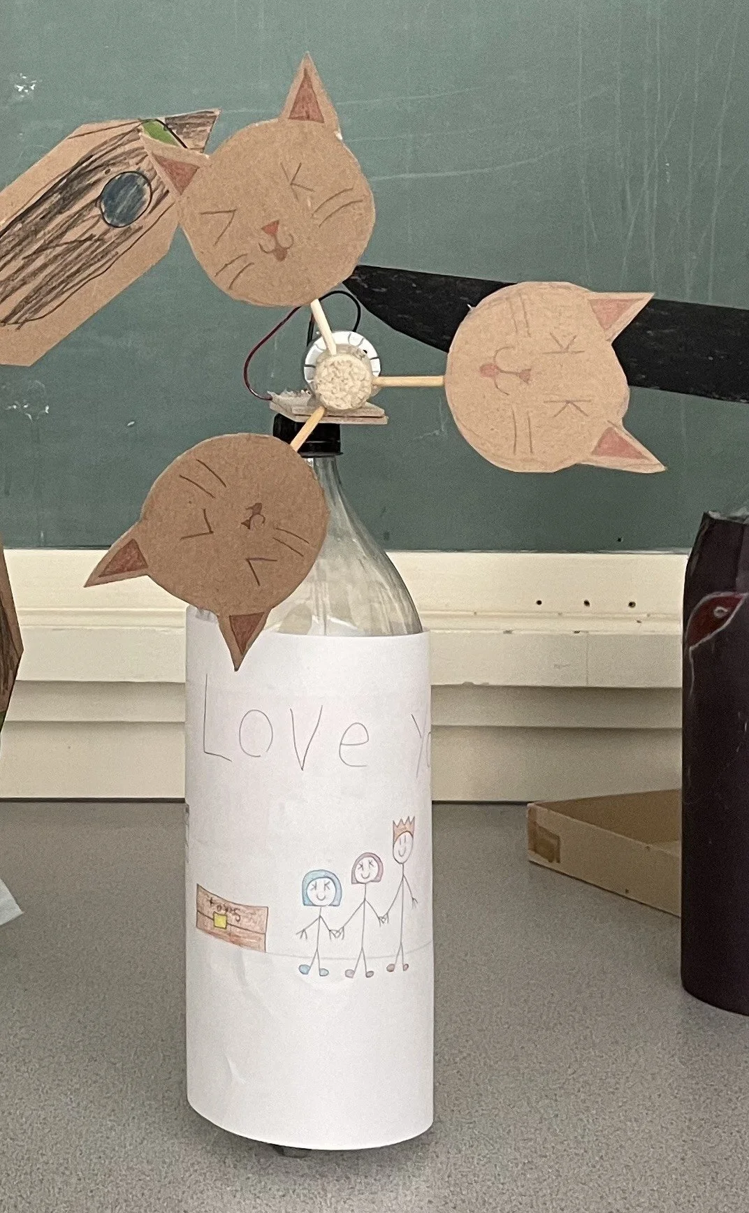 Creative wind turbine built by students at the Renewable Energy Workshop at Hixon's open house. The wind turbines are make of cardboard cat faces.