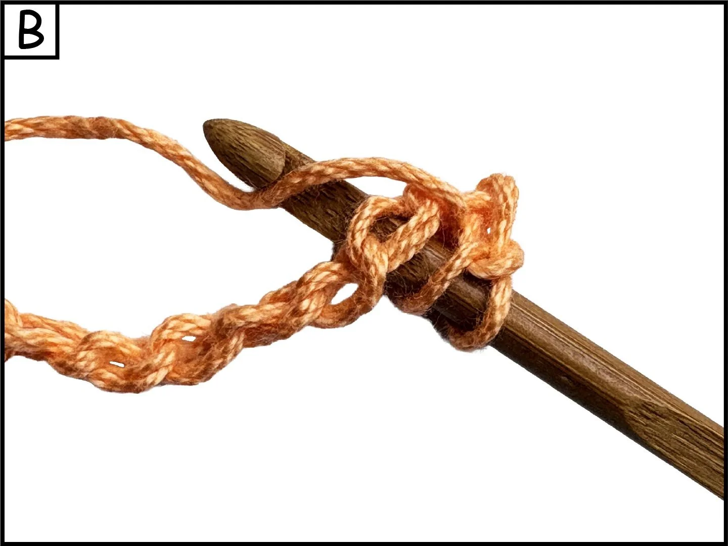 A wooden crochet hook with a tan yarn looped around it, tied in a knot.