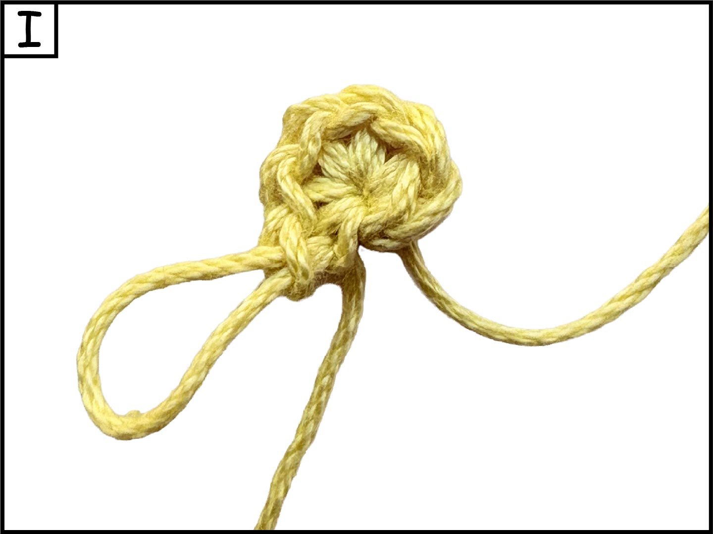 A yellow rope tied in a knot, with loose ends extending outward, on a white background.