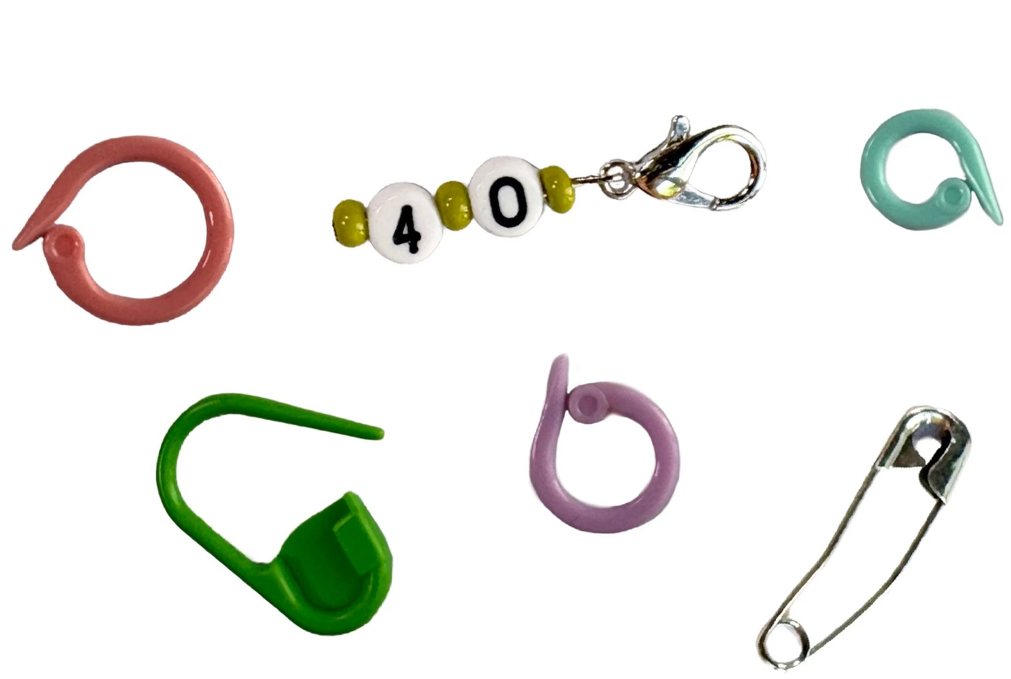 Colorful hooks, including pink, green, purple, and silver, arranged on a white background, featuring a beaded charm with dice showing 4.0 and attached to a metal clasp.