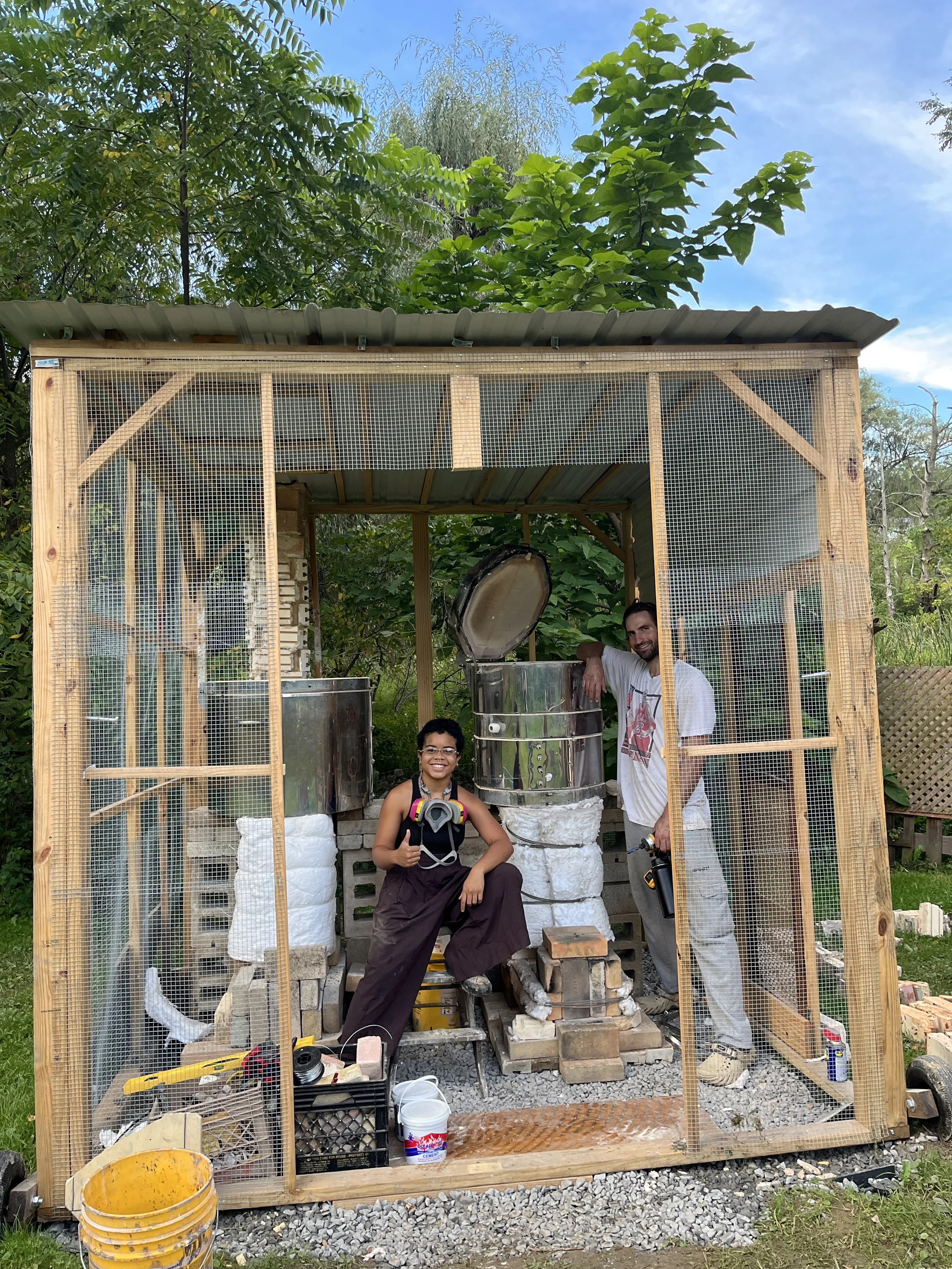 posing with kilns.JPG