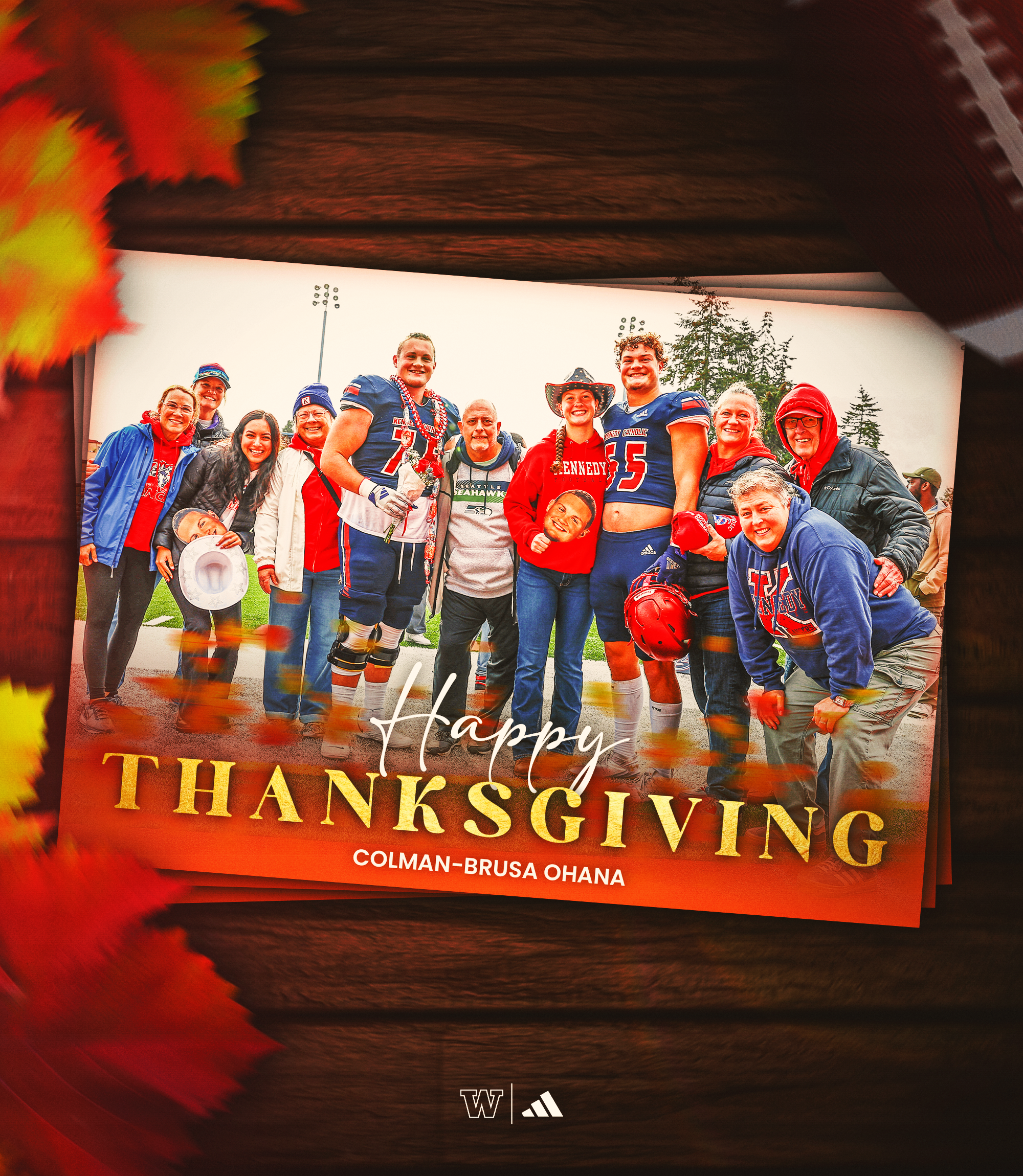 A group of people, some dressed in football gear, gathering on a field for a celebration, with fall leaves in the foreground and a message saying "Happy Thanksgiving" at the bottom.