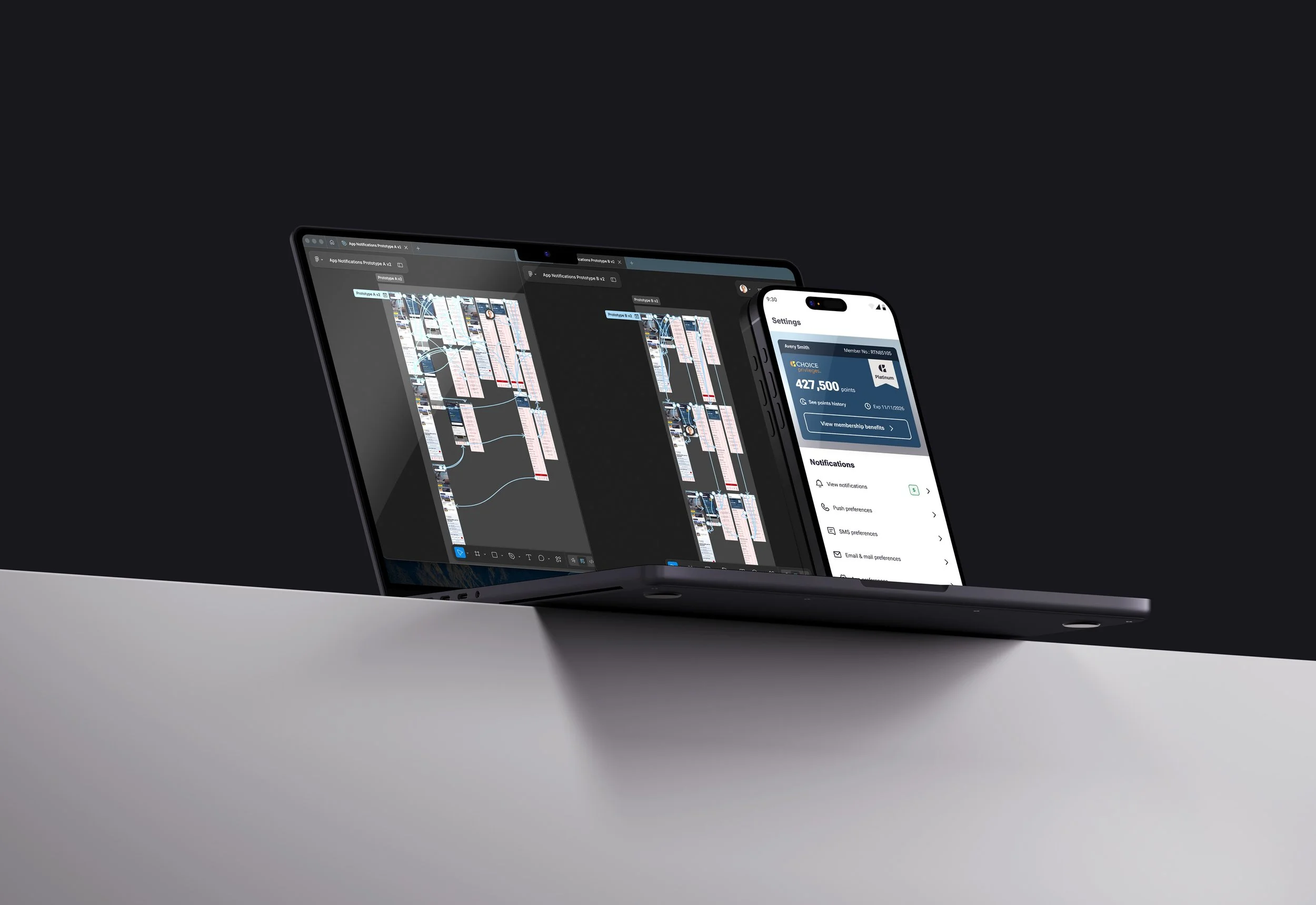 laptop and phone on a table with a prototype for testing