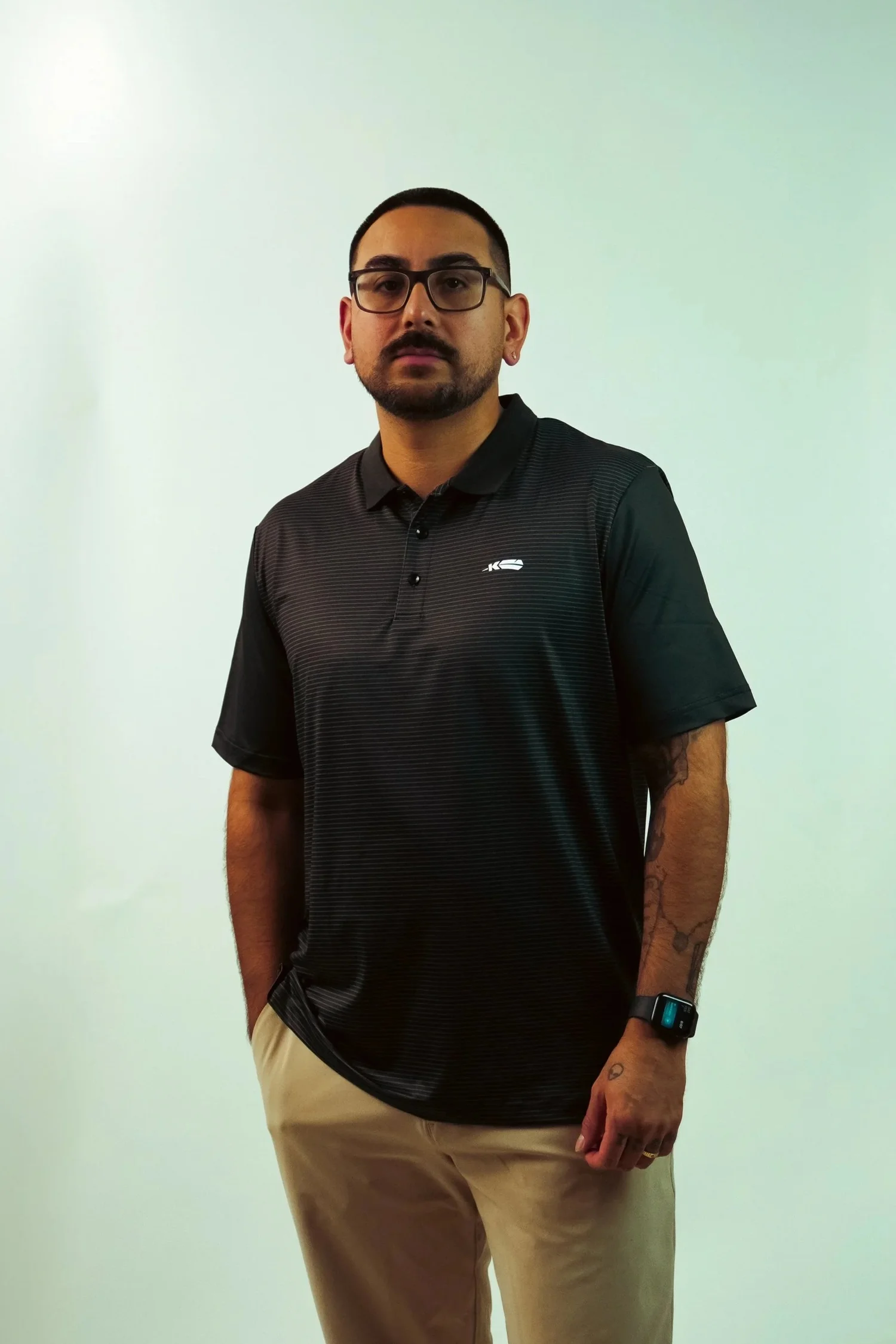 Kingfisher Golf Black Striped Polo — on model
