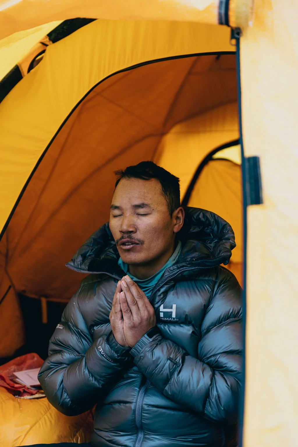 Tendi Sherpa enjoying a meditative moment on the Rugged Luxury Everest Base Camp trek