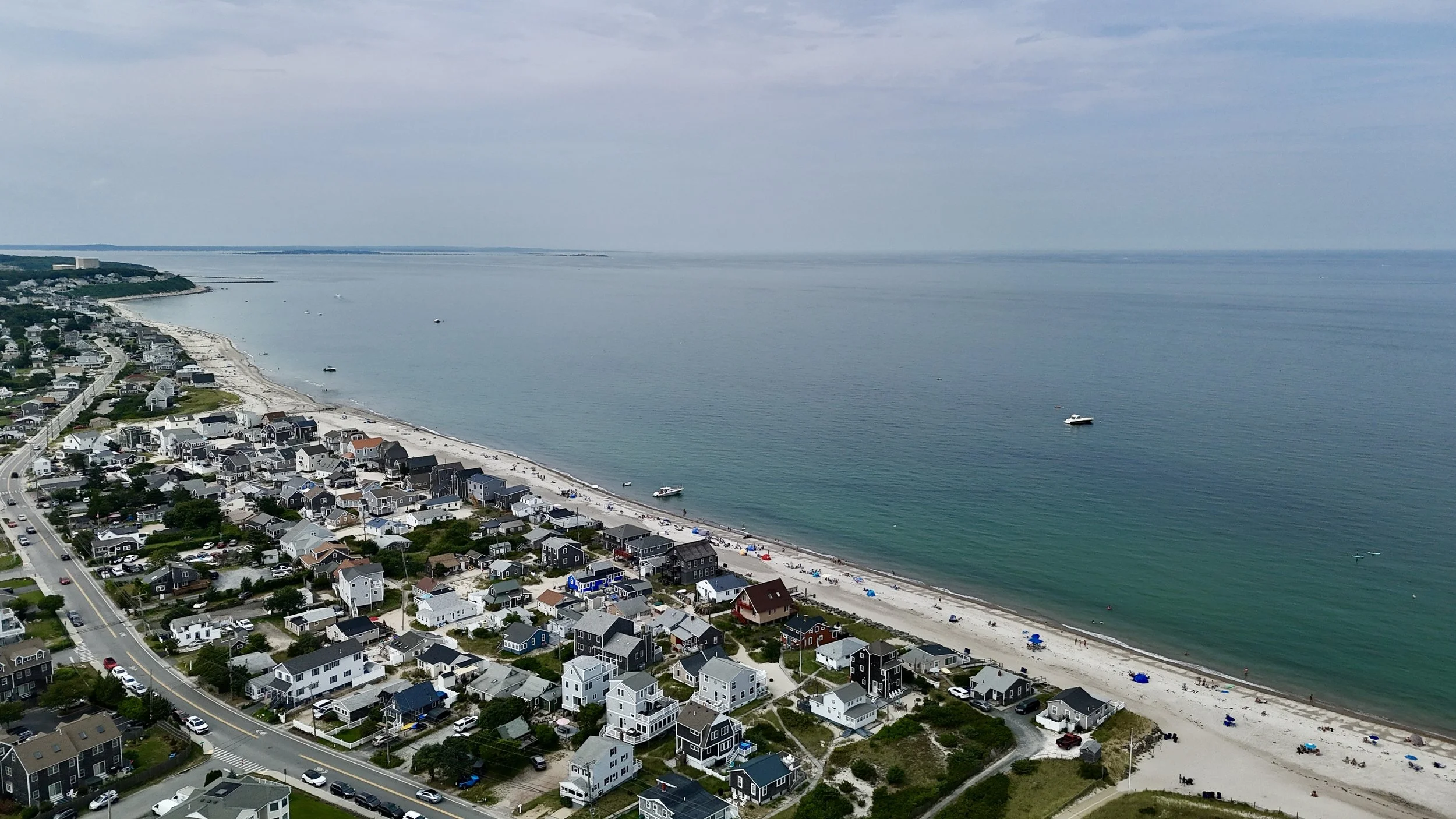 Altitude Drone Dynamics aerial view of land surveillance in a coastal beach side neighborhood for real estate photography and videography in New England.