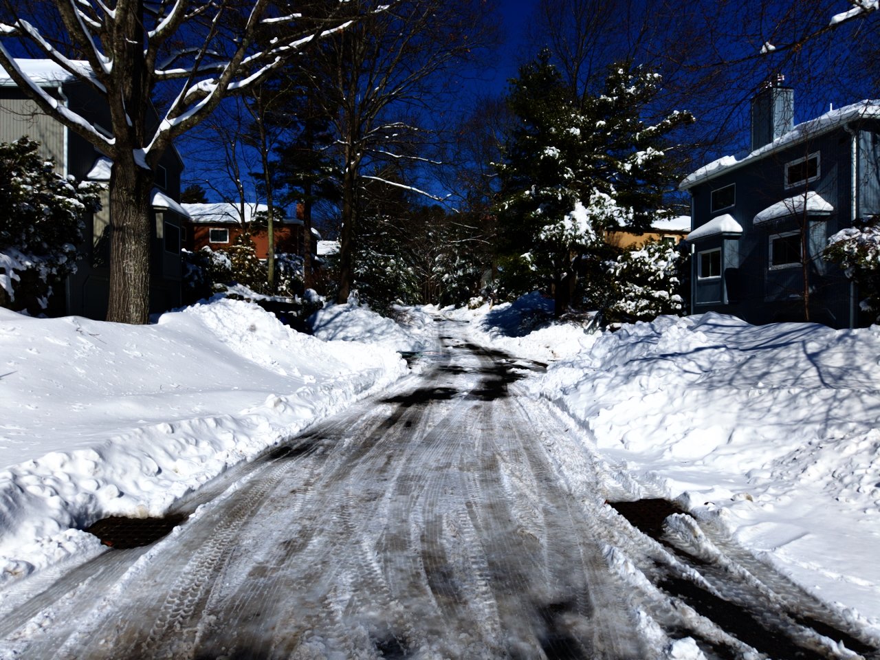 Drone, aerial photography of a recent snowfall in New England, Massachusetts, blizzard 2026, blue sky, snow