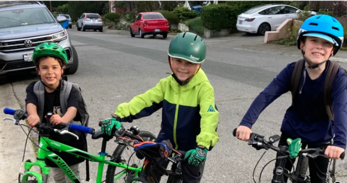 3 kids on bike, Argus, ride in rain