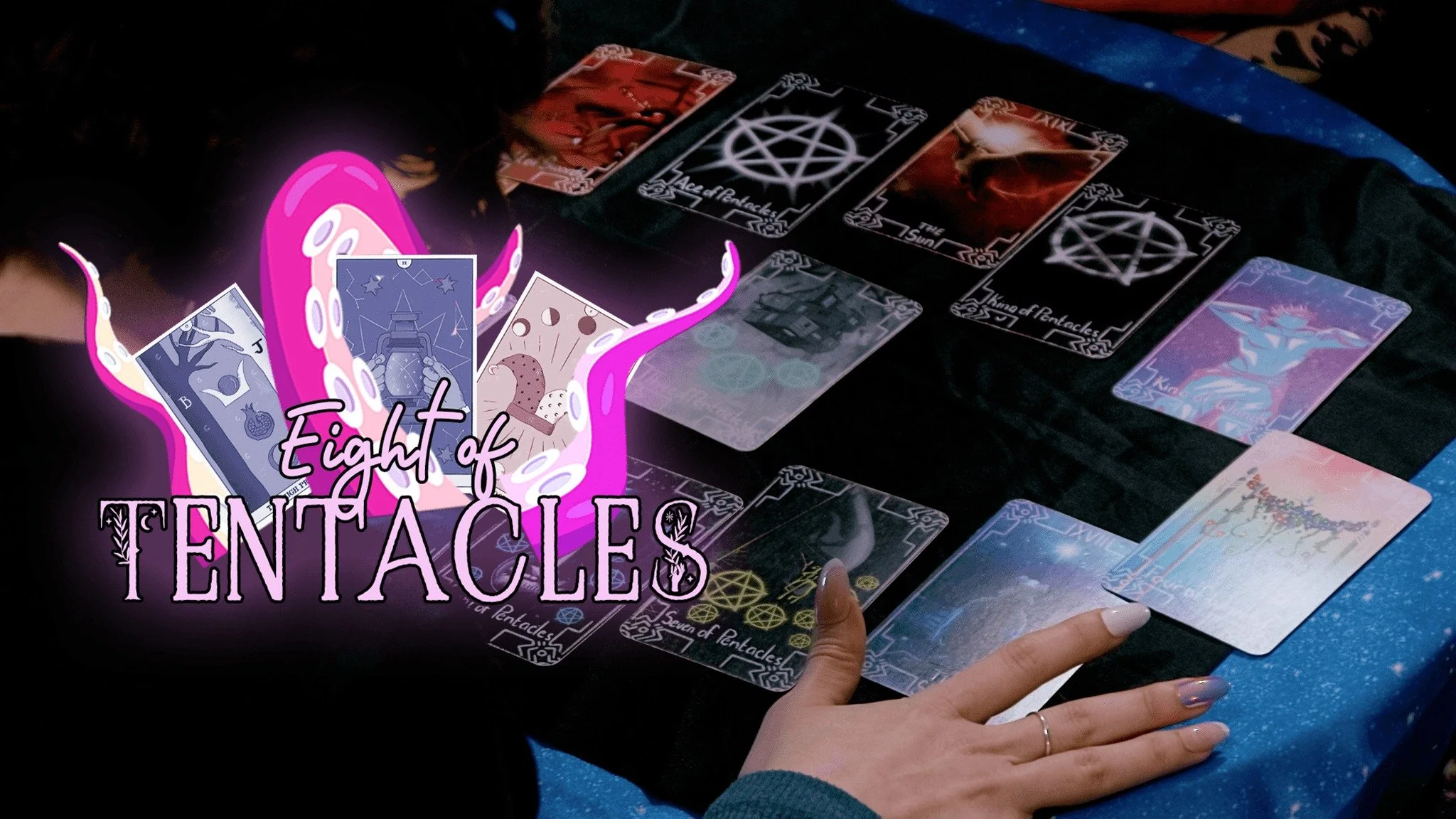 A tarot card reading spread on a black cloth with various tarot cards, a hand with a ring resting near the cards, and a graphic overlay with purple and pink tentacle imagery and the text 'Eight of TENTACLES'.