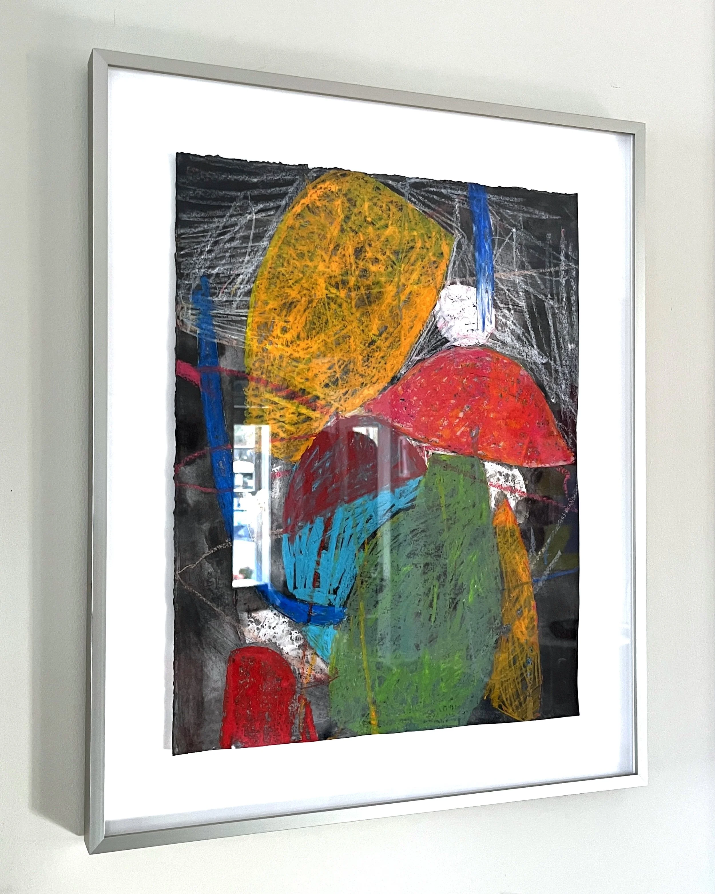 All works on paper framed in a warm, silver metal frame.