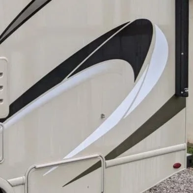Close-up of a black, white, and gray pattern on the side of a recreational vehicle or camper trailer.