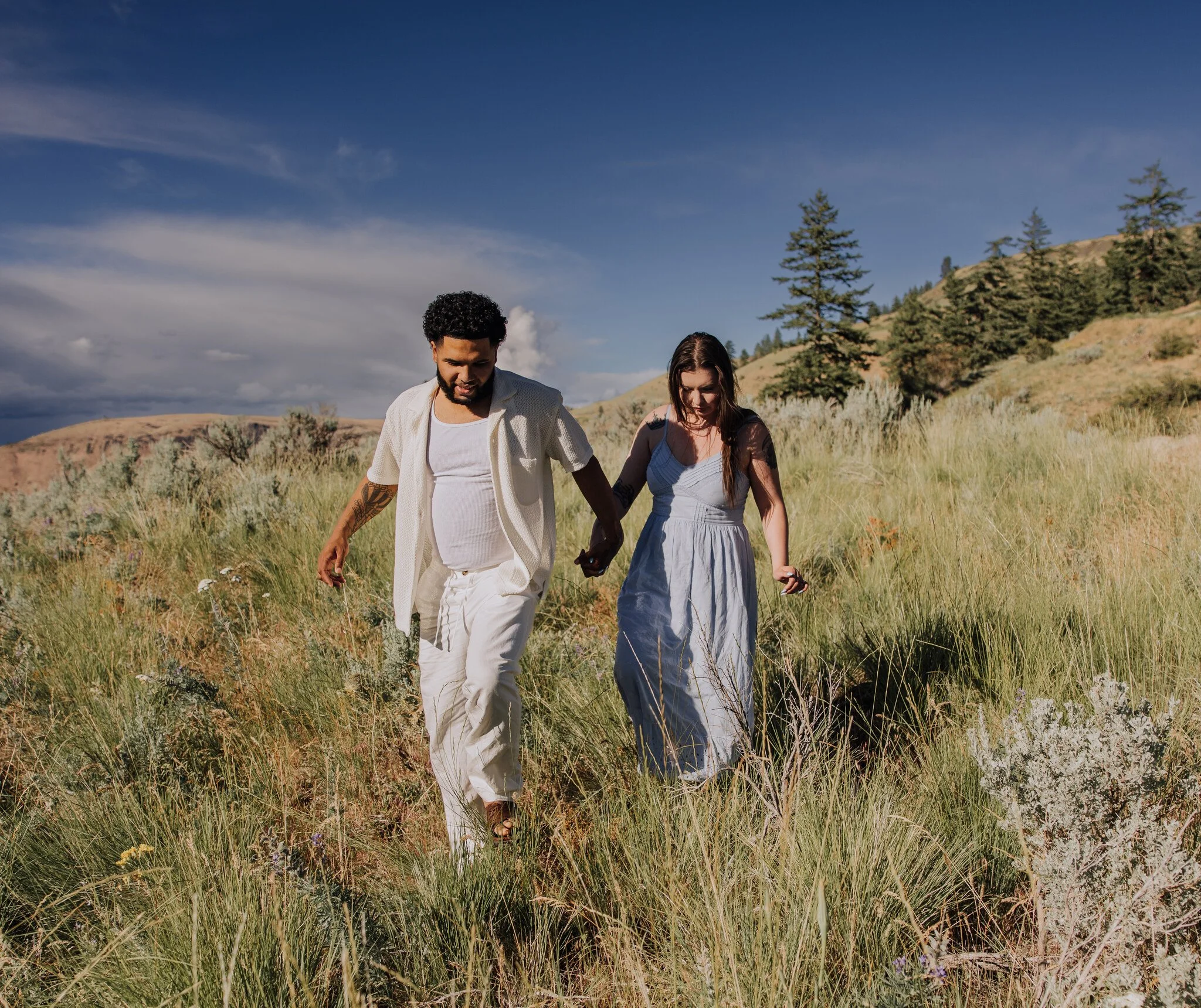 lake-chelan-engagement-photographer-couple-walking-golden-field-11.jpg