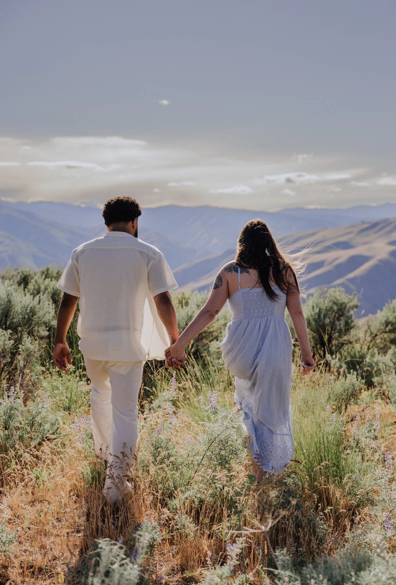 lake-chelan-engagement-photographer-couple-holding-hands-mountains-18.jpg