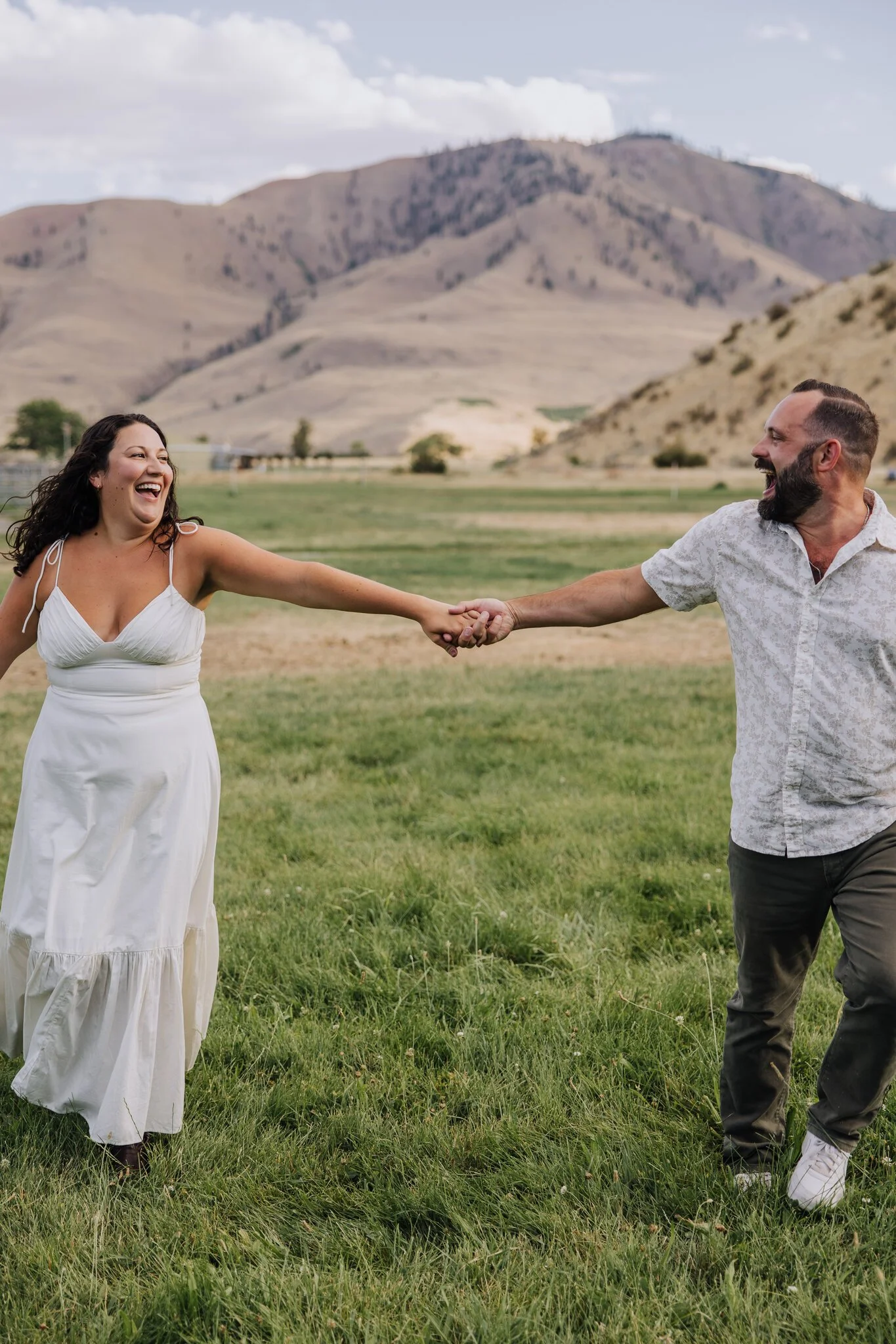 lake-chelan-proposal-photographer-couple-laughing-hands-18.jpg