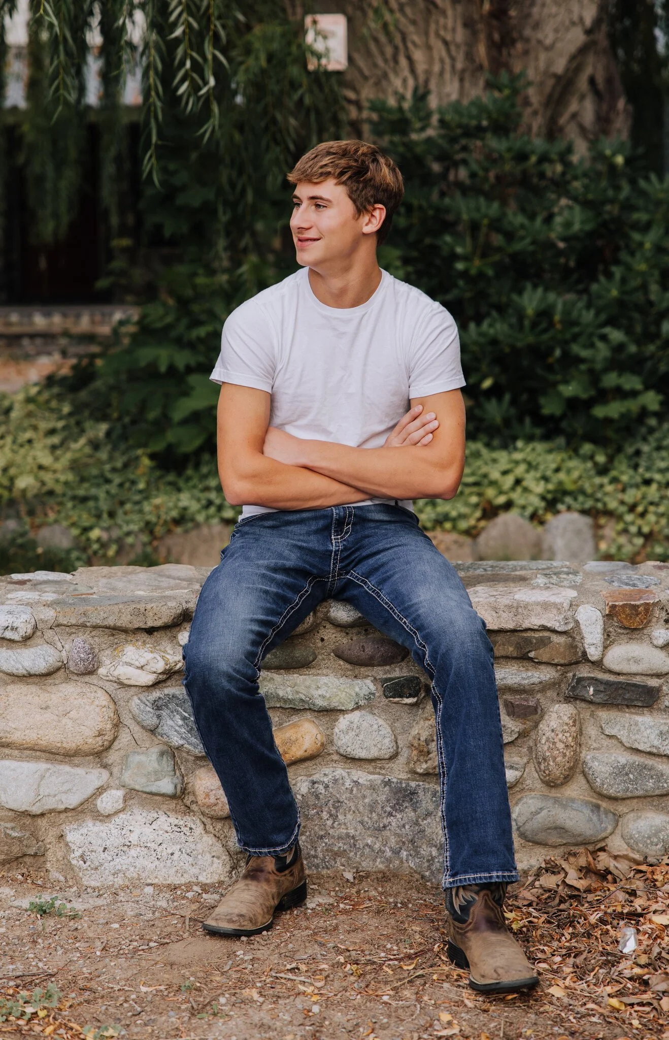 lake-chelan-senior-photographer-stone-wall-arms-crossed-03.jpg