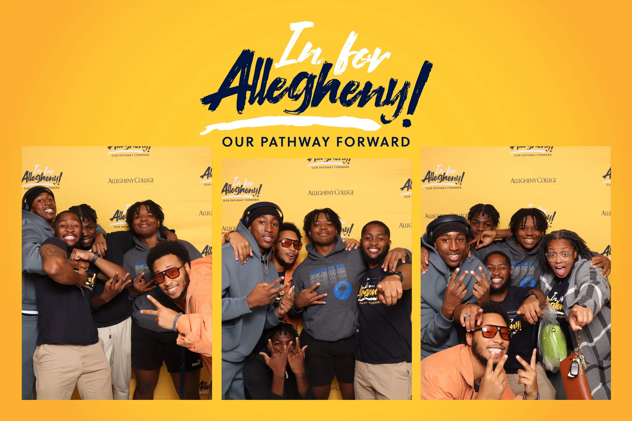 Group of diverse young adults posing and smiling in front of a yellow backdrop with the text 'In for Allegheny! Our Pathway Forward' at an event for Allegheny College.