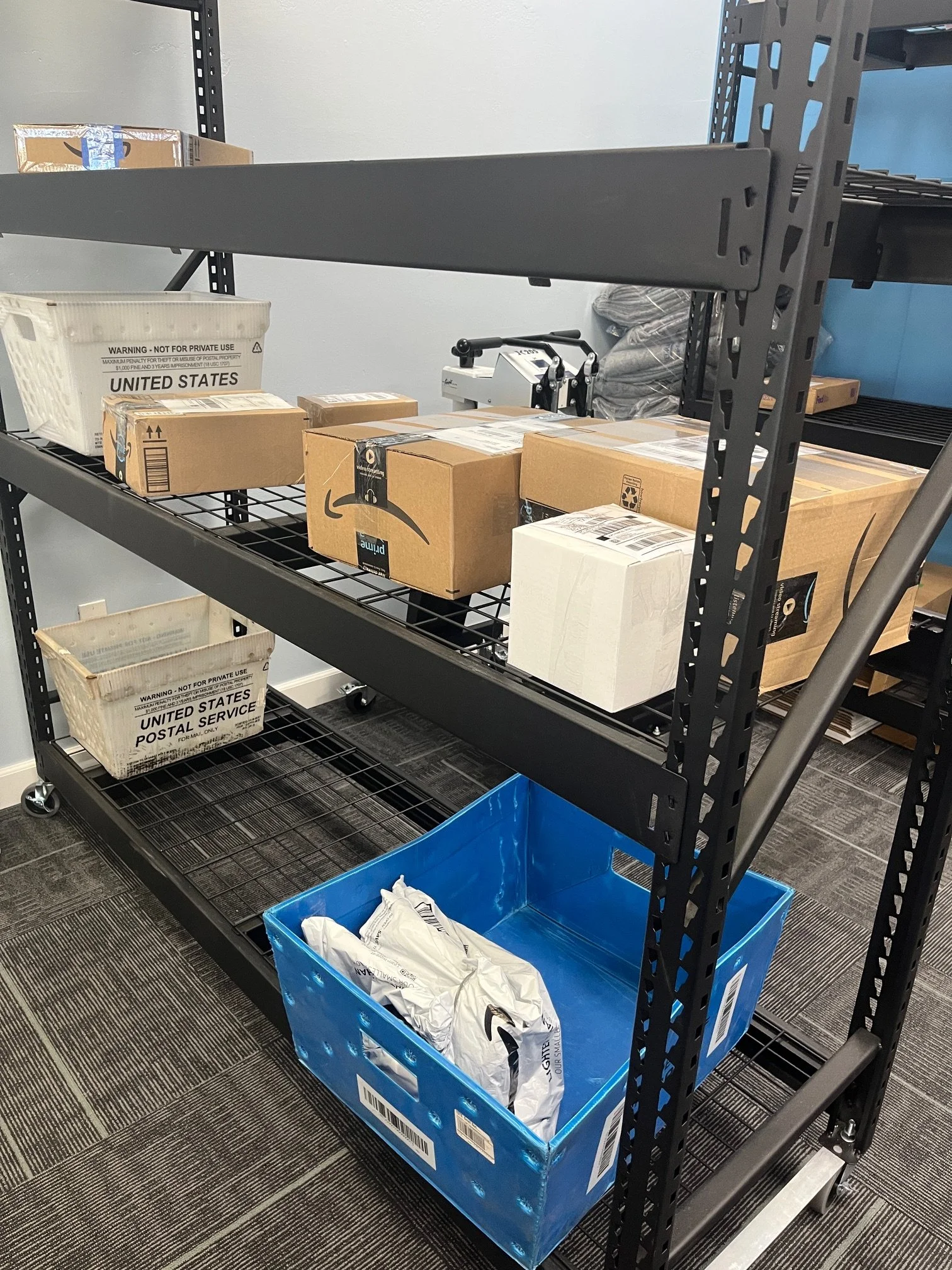 UPS, USPS, FEDEX Packages on a storage Rack