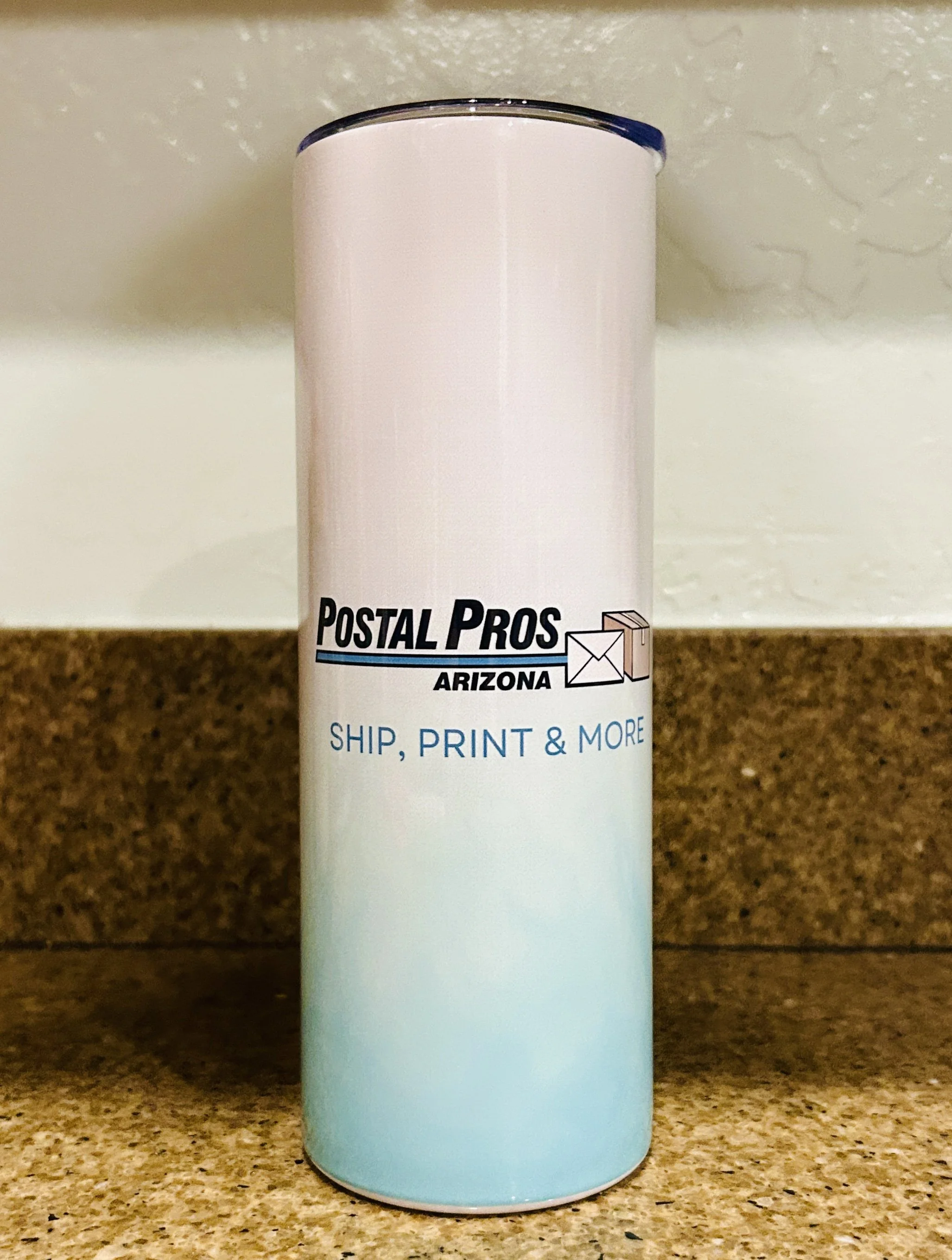 Tumbler that has been sublimated with the Postal Pros AZ logo.