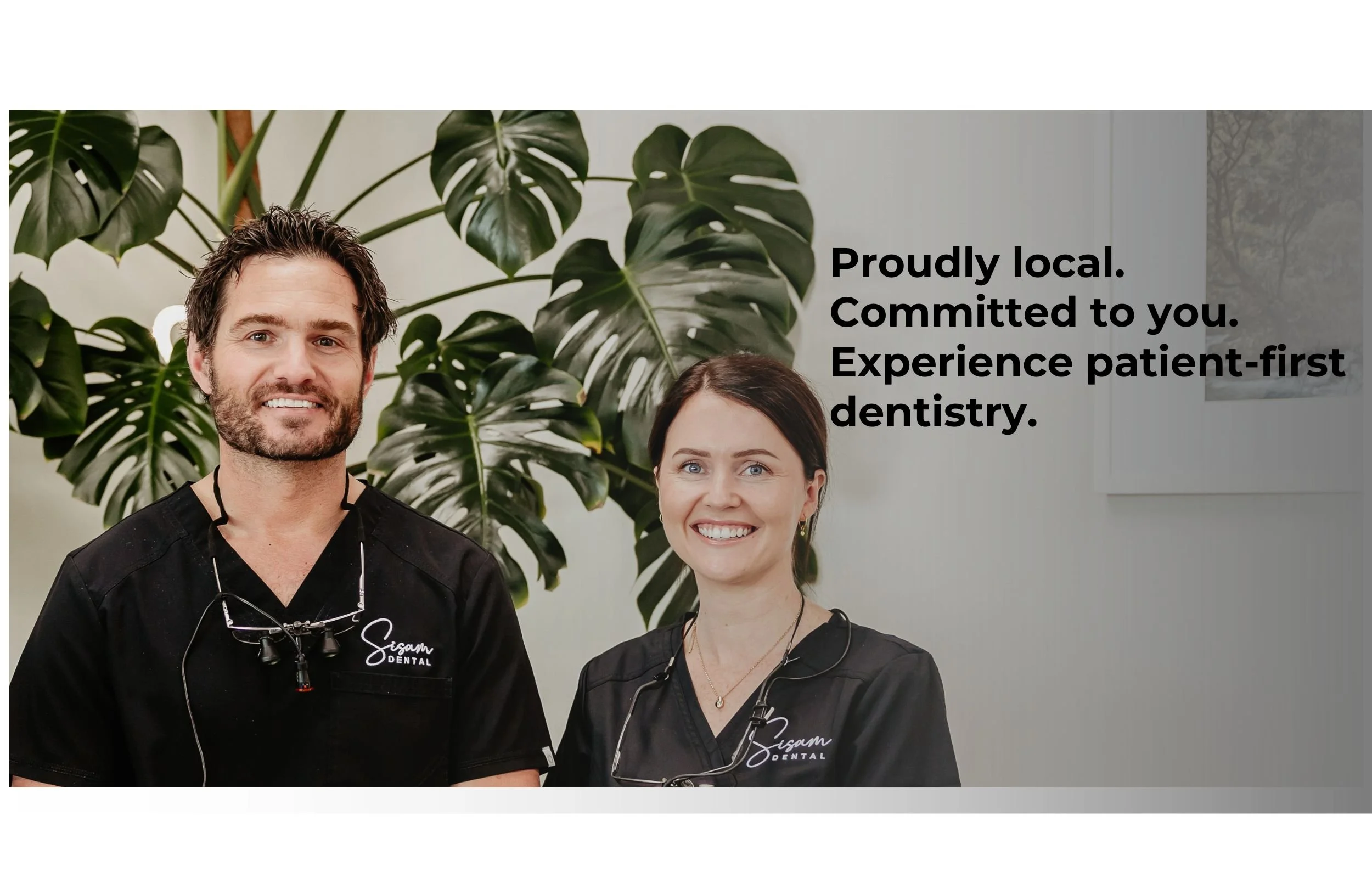 Two dental professionals, a man and a woman, standing in front of a green plant, smiling at the camera, with text overlay stating their commitment to community and patient-centered dentistry.