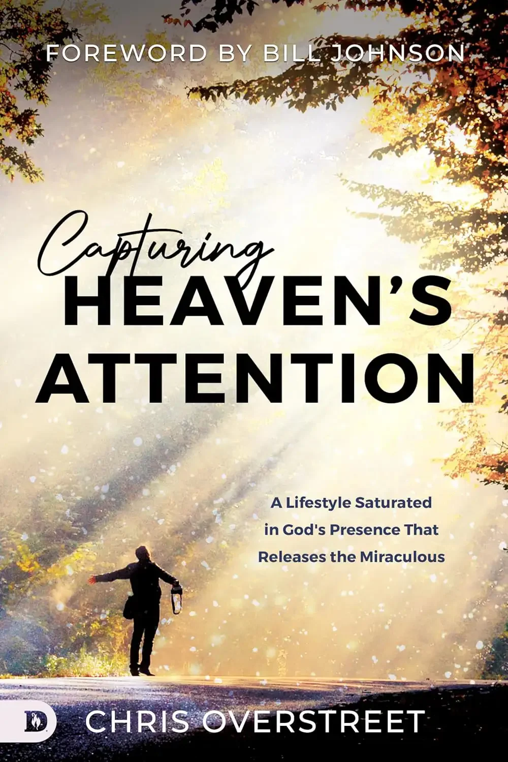 A person walking on a tree-lined path with rays of sunlight shining through the leaves. The book cover features the title 'Capturing Heaven's Attention' and a subtitle, with a foreword by Bill Johnson, written by Chris Overstreet.