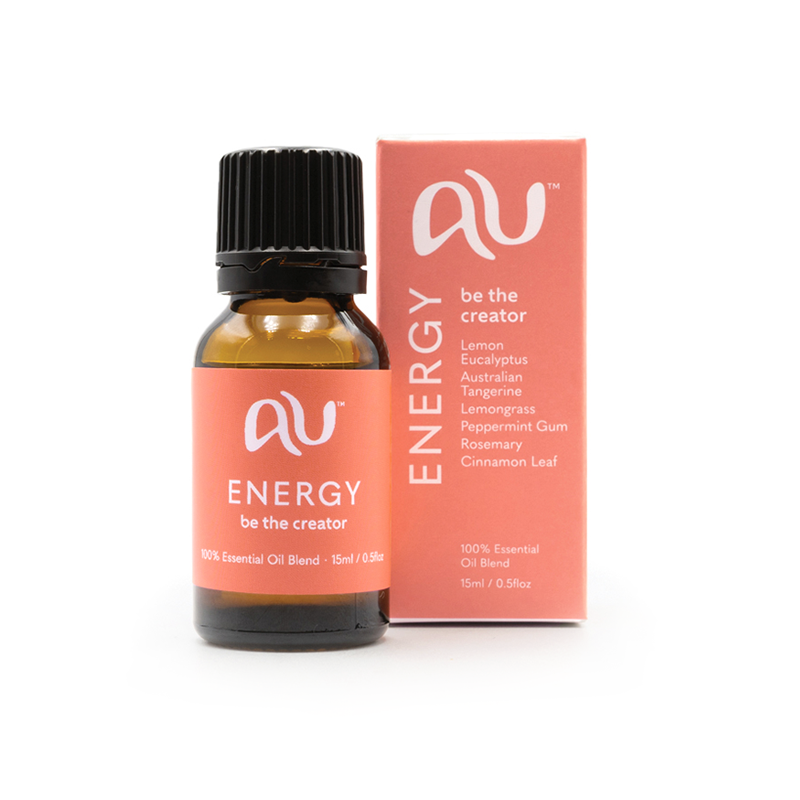 The Energy Essential Oil Blend bottle is sitting next to its box on a white background. The box and bottle are branded in a coral colour.