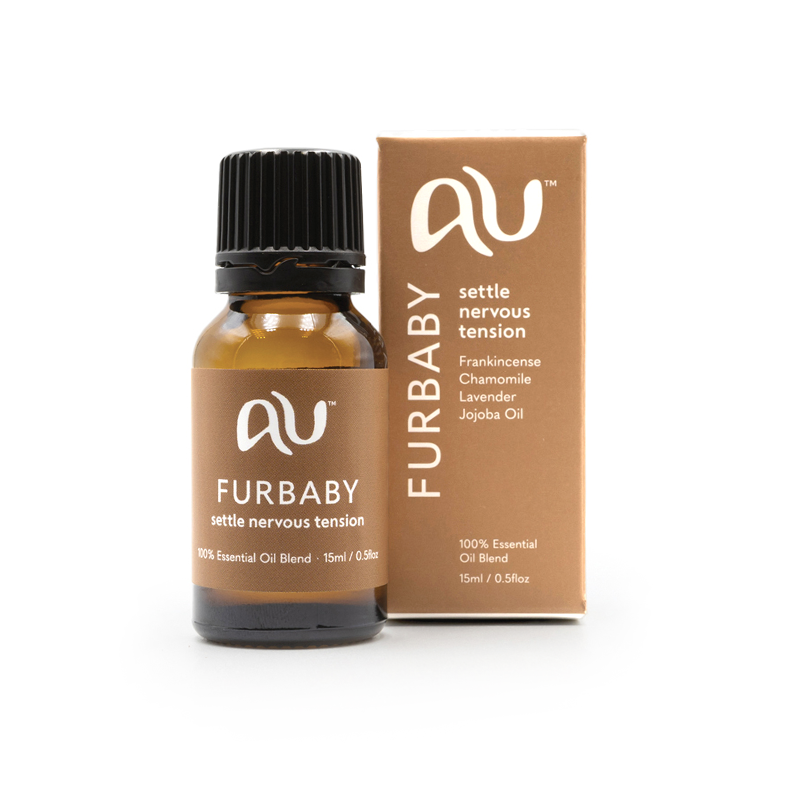 The Furbaby Essential Oil Blend bottle is sitting next to its box on a white background. The box and bottle are branded in a mushroom colour.