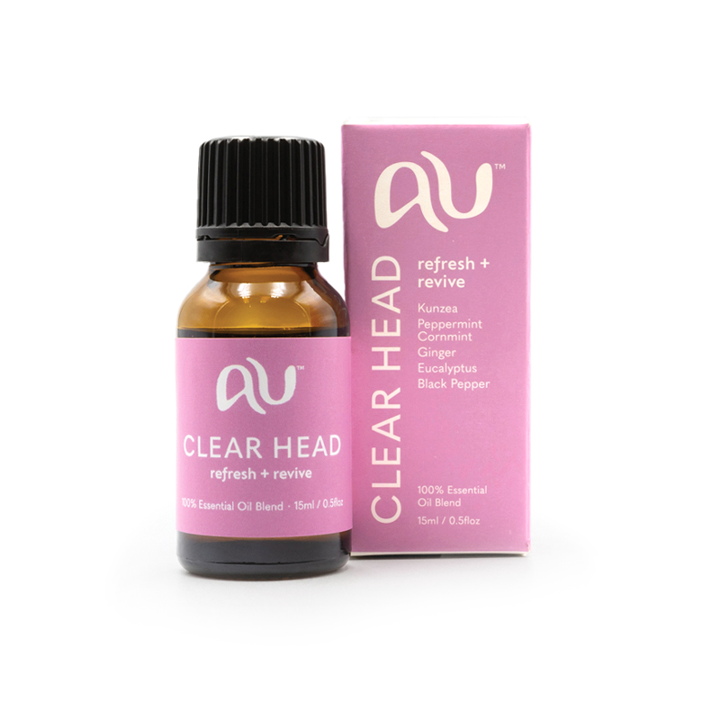 The Clear Head Essential Oil Blend bottle is sitting next to its box on a white background. The box and bottle are branded in a soft magenta colour.