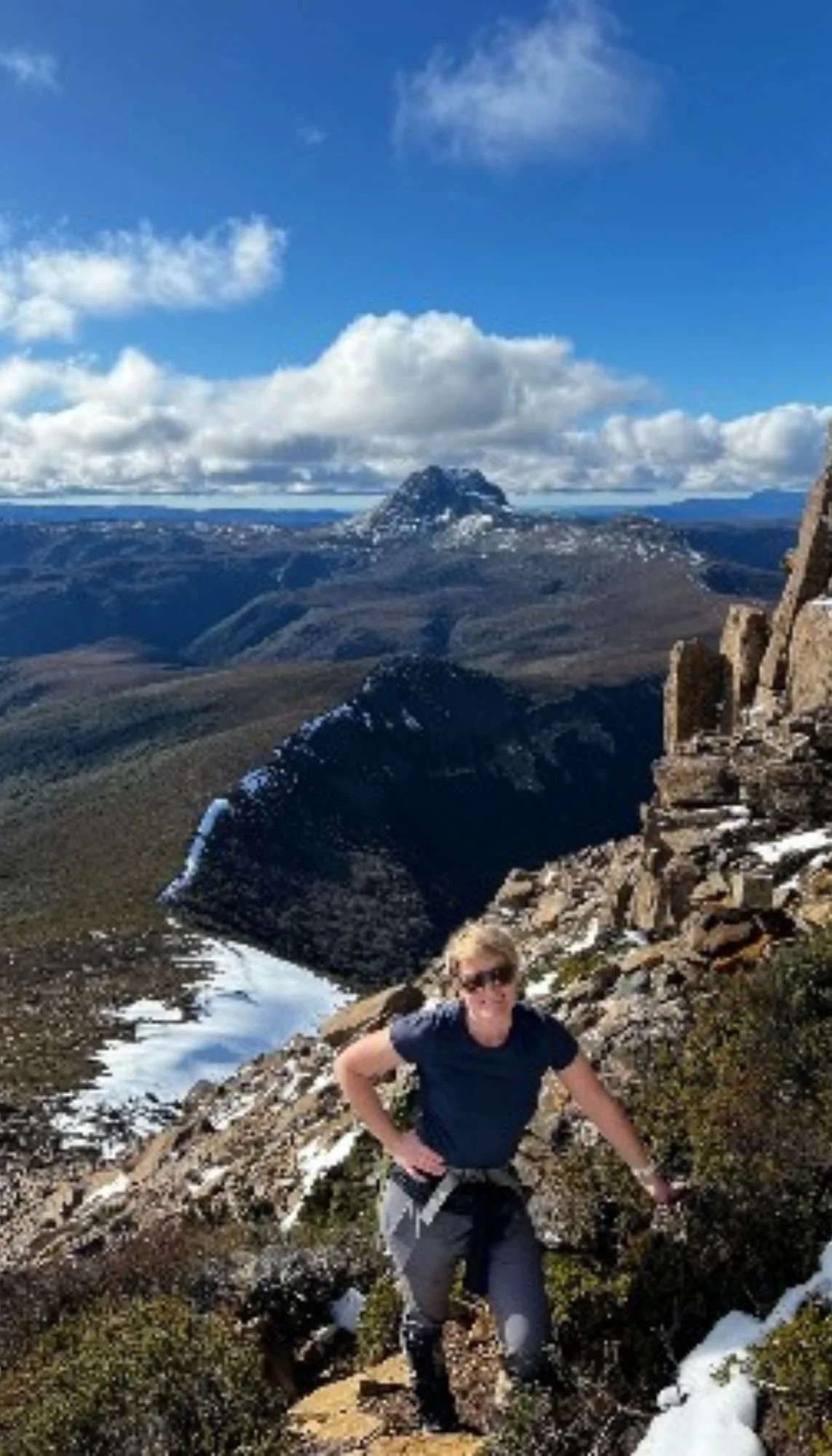 hiker standing on cradle mountain summit