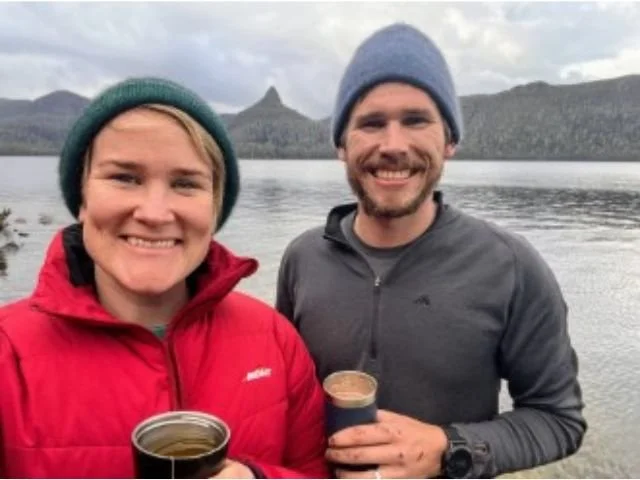 hikers standing near lake st clair