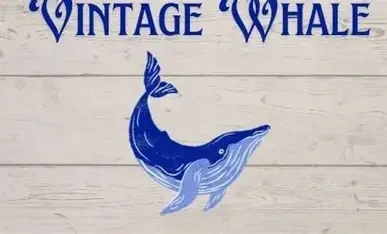 Sign with text 'Vintage Whale' and an illustration of a blue whale.