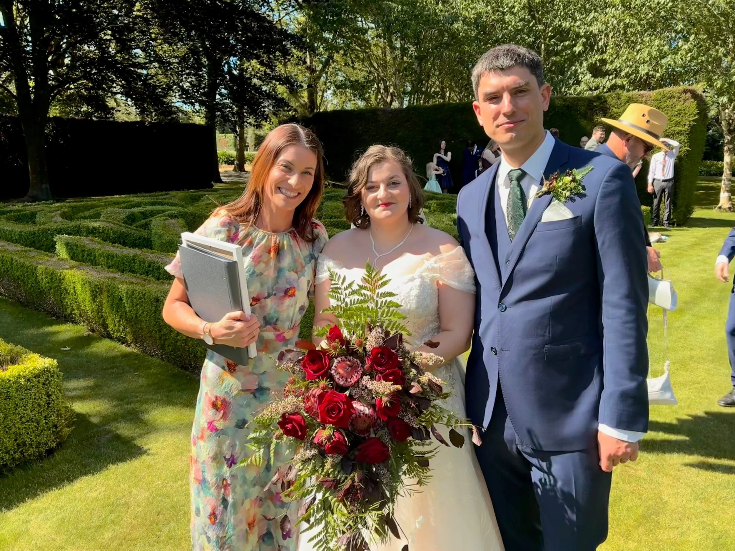 Celebrant Ollie van der Pol with a couple at their wedding ceremony at Trott’s Garden in Ashburton.