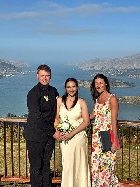 Bride and groom celebrating with their celebrant following a relaxed elopement ceremony in Christchurch Port Hills