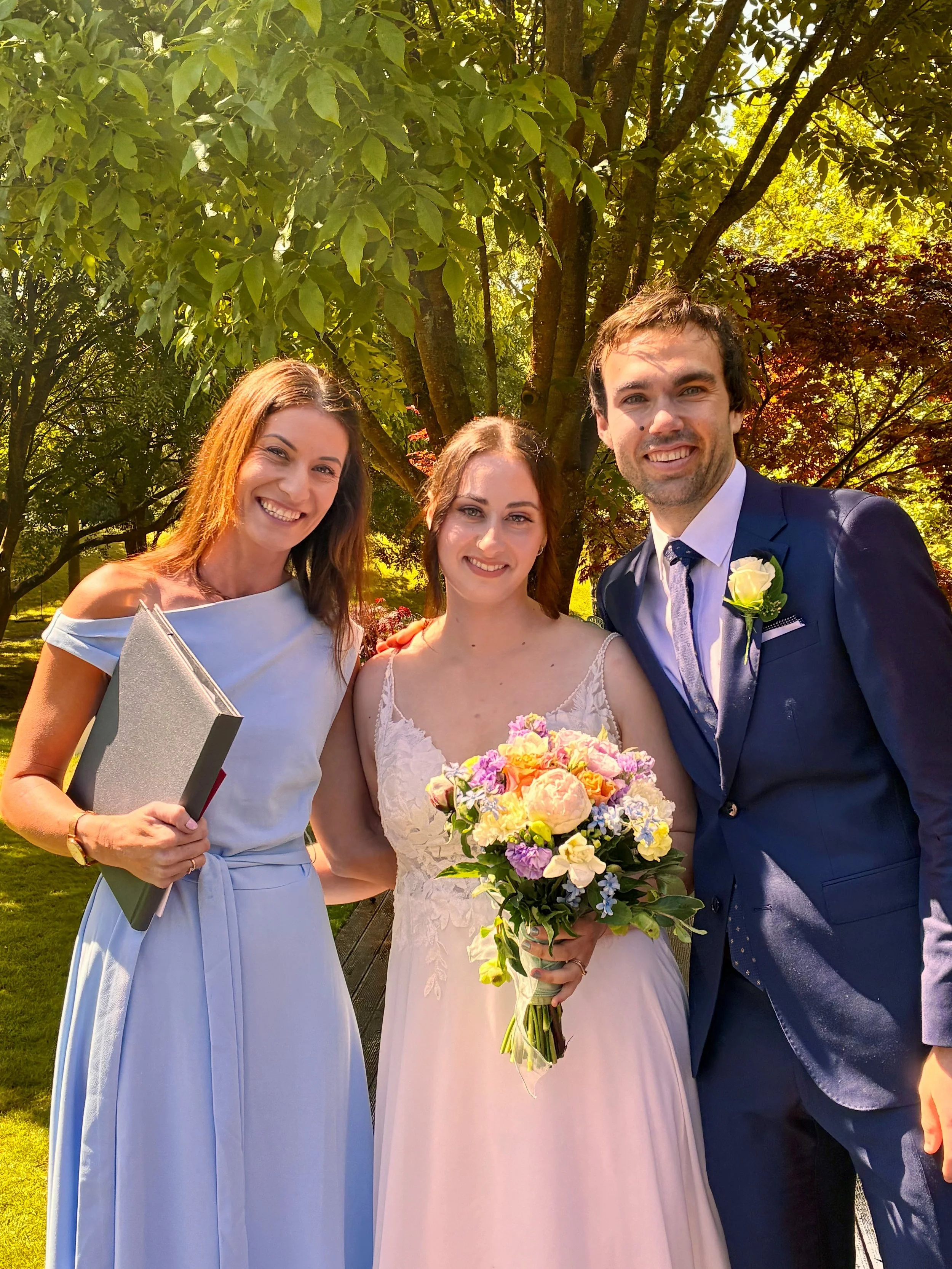 Celebrant Ollie van der Pol with a couple after their wedding ceremony at The Vines Club.