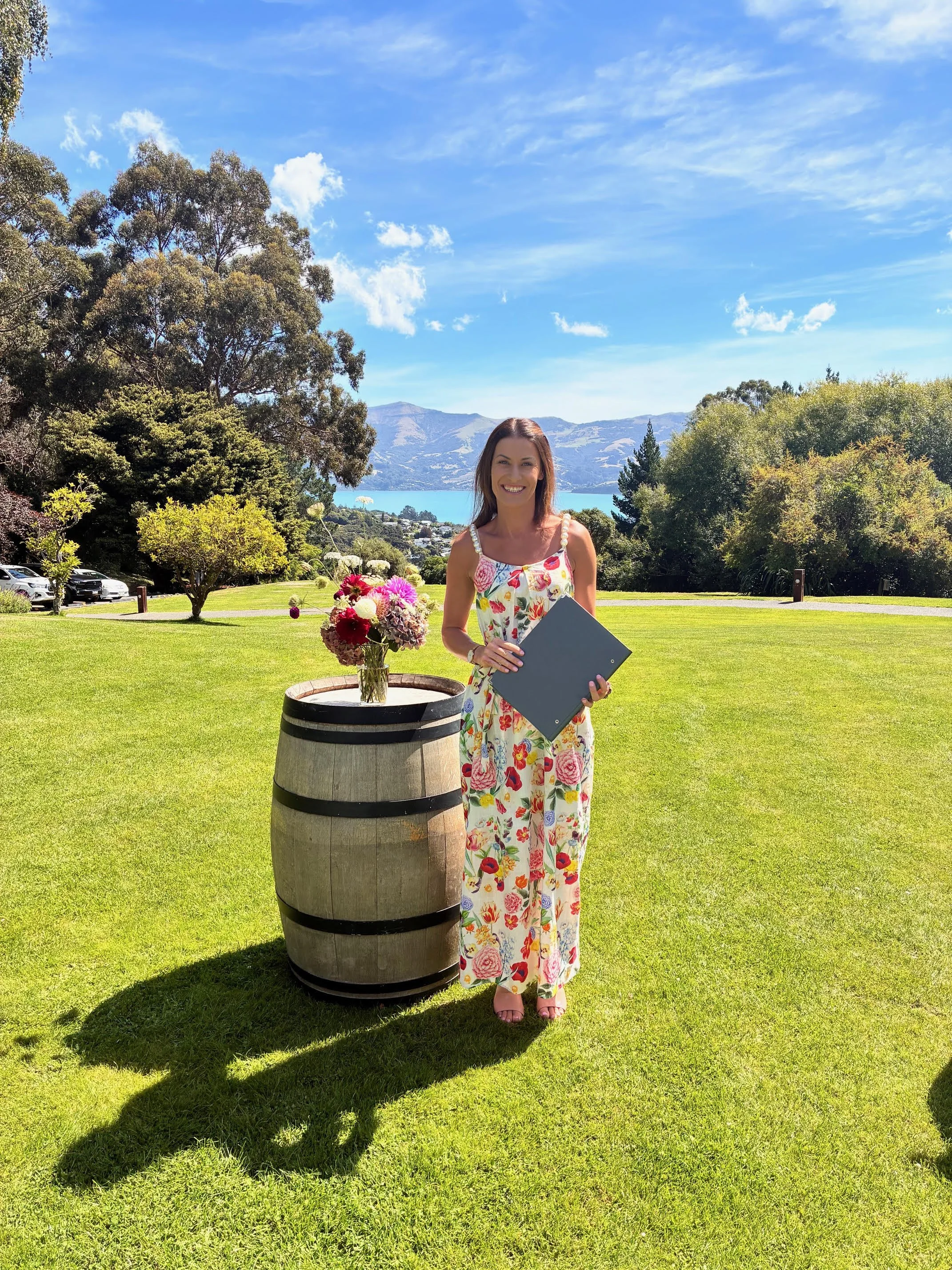Ollie, professional wedding celebrant, officiating a personalised outdoor wedding ceremony at Mt Vernon, Akaroa