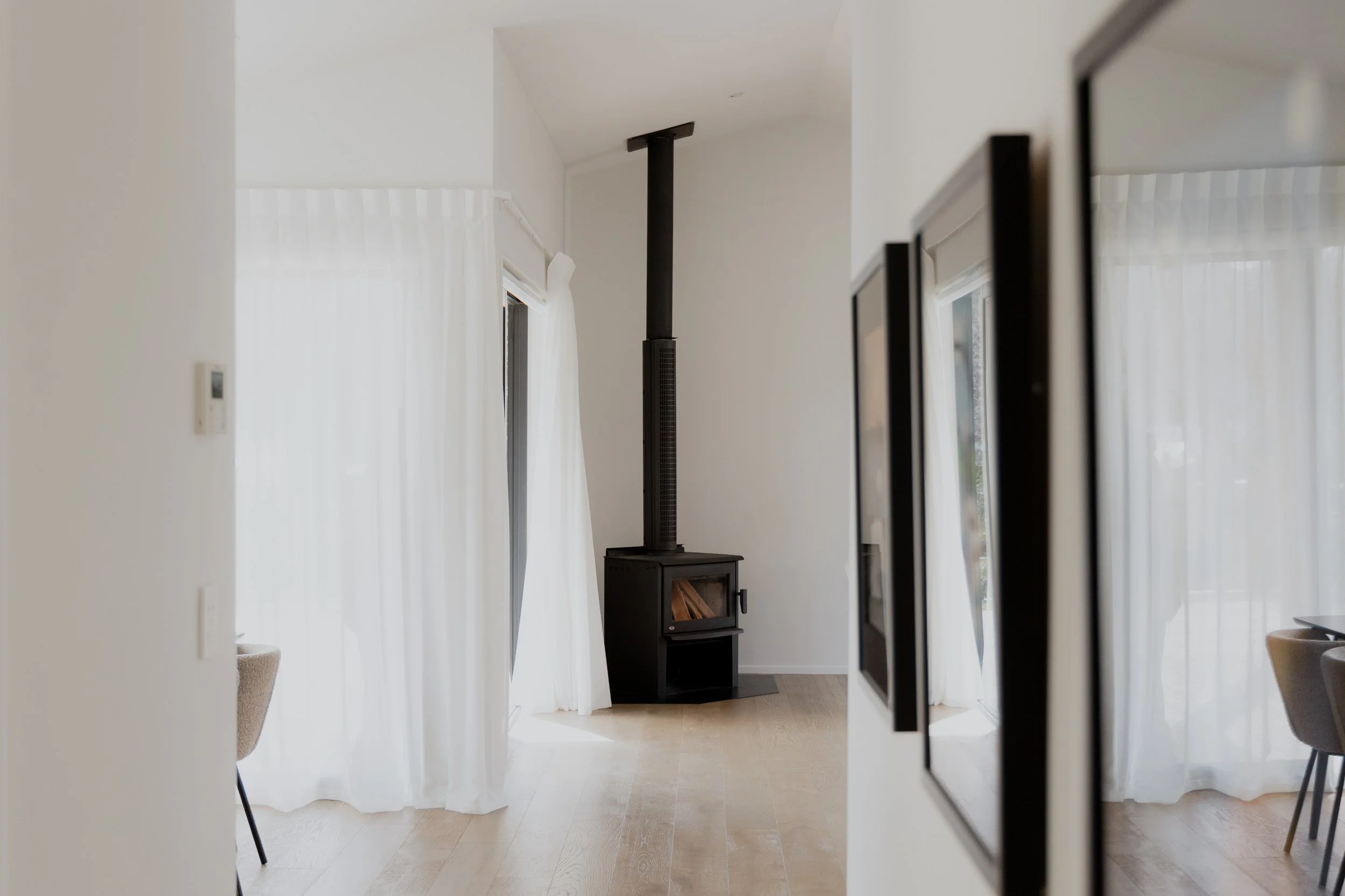 The lounge space with fireplace in a Kingston home built by Otago Homes Queenstown.
