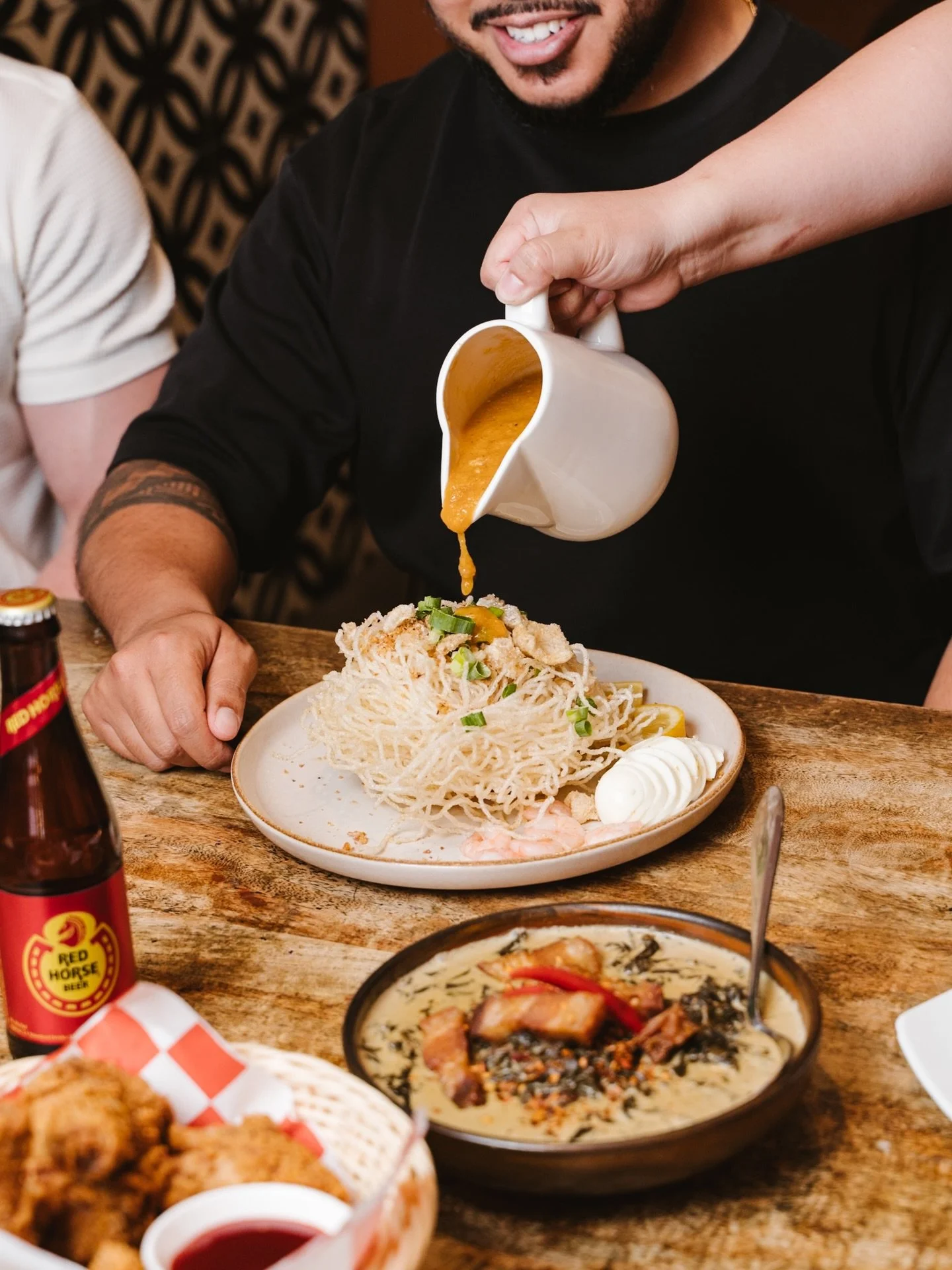 Our Crispy Palabok at Mama Lor is the ultimate comfort dish. 

Crunchy noodles topped with rich, savoury sauce, prawns, egg, and all the classic Filipino goodness poured on fresh to your table 🤍🔥