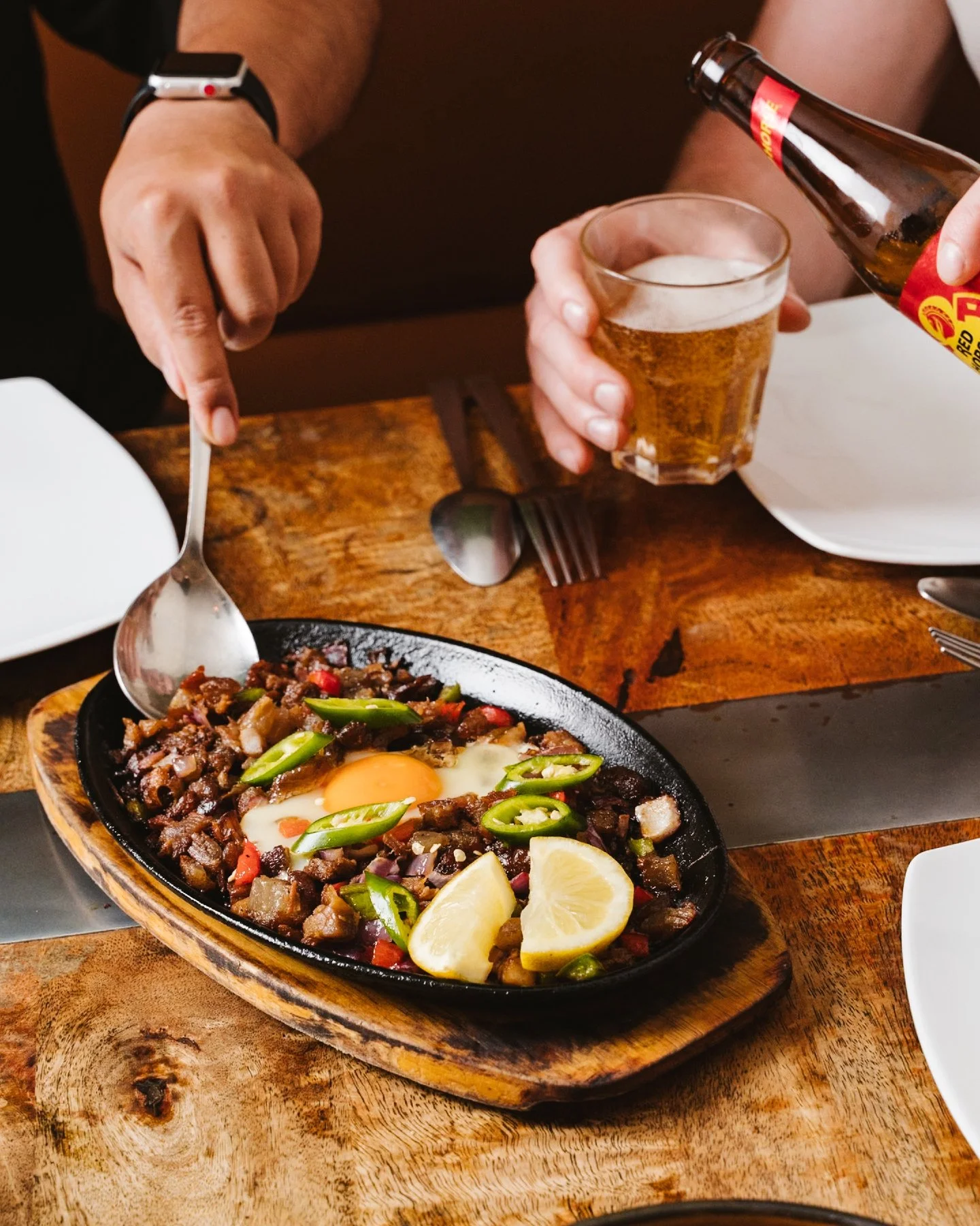 Sizzling Pork Sisig done the right way 🔥🇵🇭

Crispy, juicy pork tossed with onions and chilli, topped with a perfectly runny egg and served on a hot plate that keeps it crackling to the last bite 🤤🍳

Mix it up, squeeze that lemon, and enjoy it be
