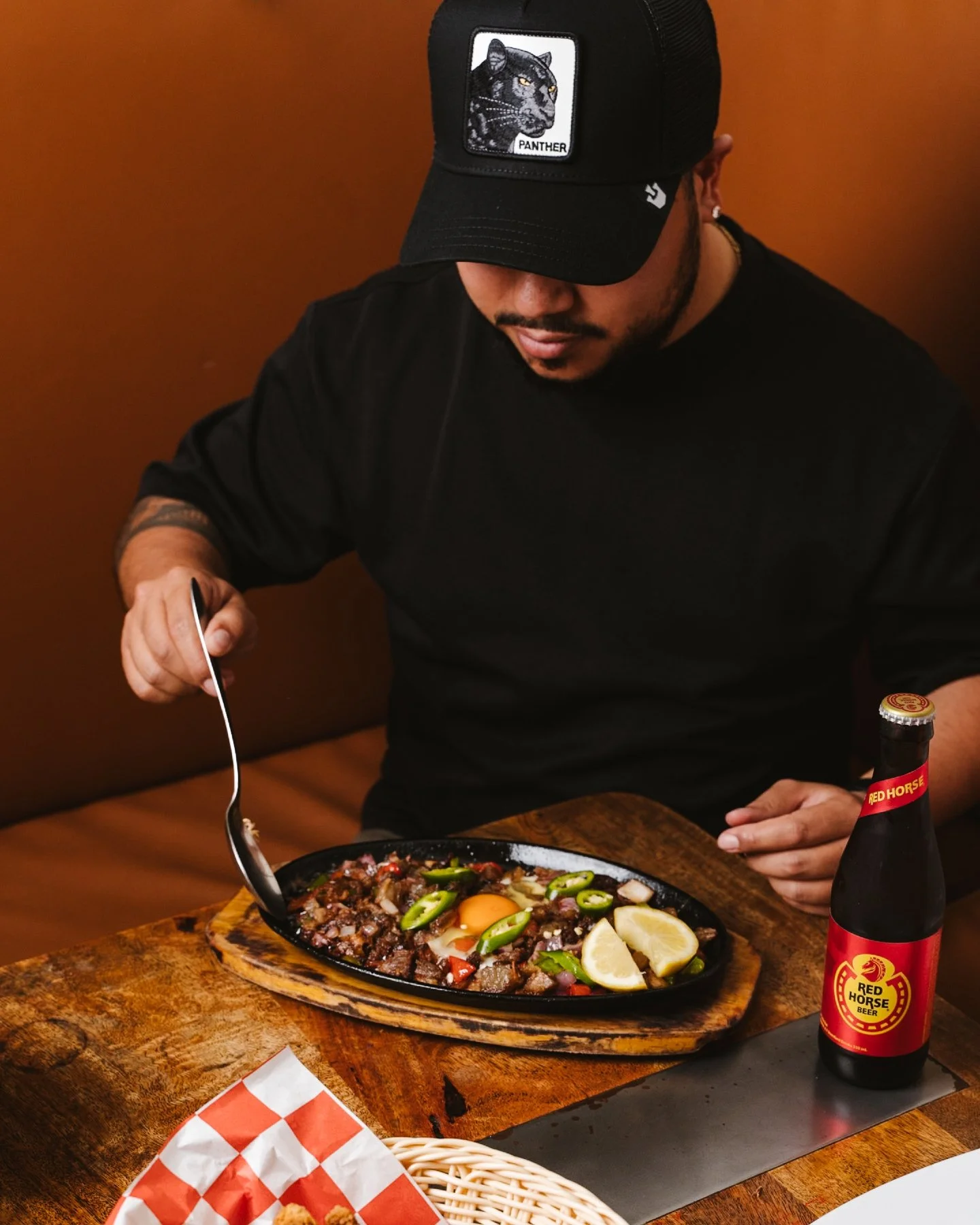 Sizzling, crispy, and packed with flavour 🔥

Our Sisig is chopped, seasoned, and served hot on a sizzling plate with chilli, citrus, and a fresh egg right in the centre. Bold, savoury, and made to hit every bite.

Pair it with an ice cold Red Horse 