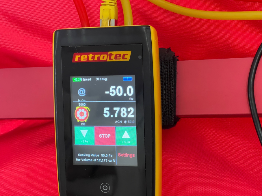 Certified blower door testing equipment staged for residential energy inspection